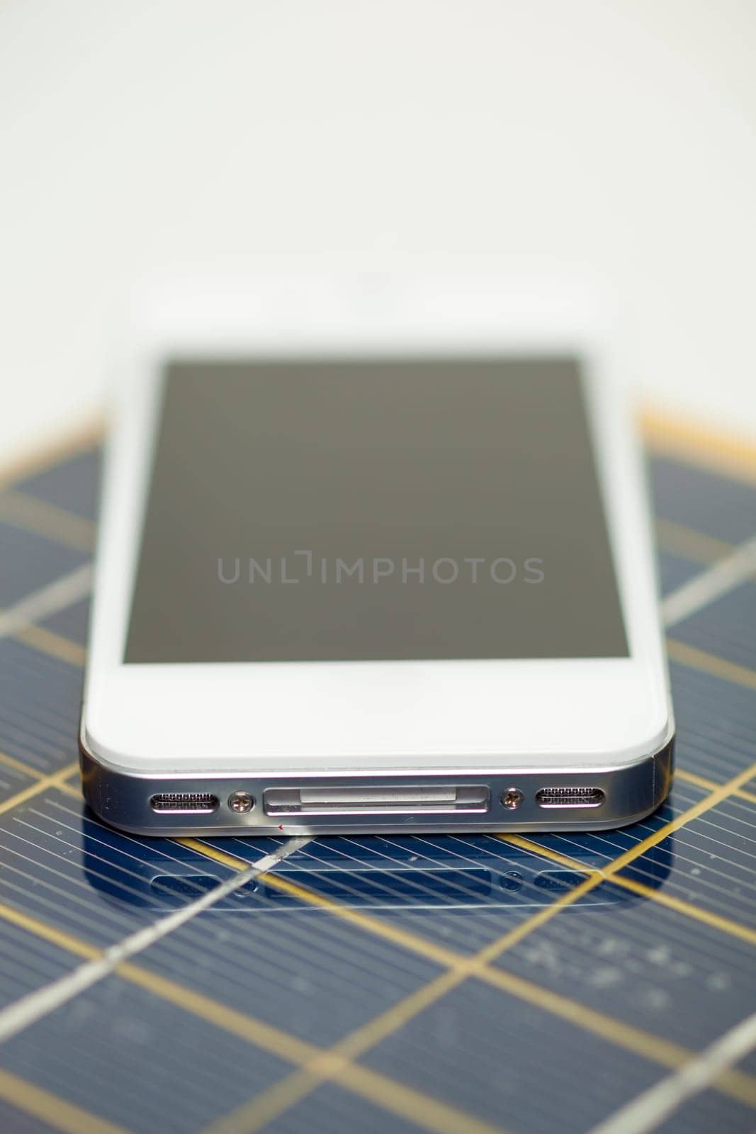 Green energy concept - Mobile Phone charging with solar power