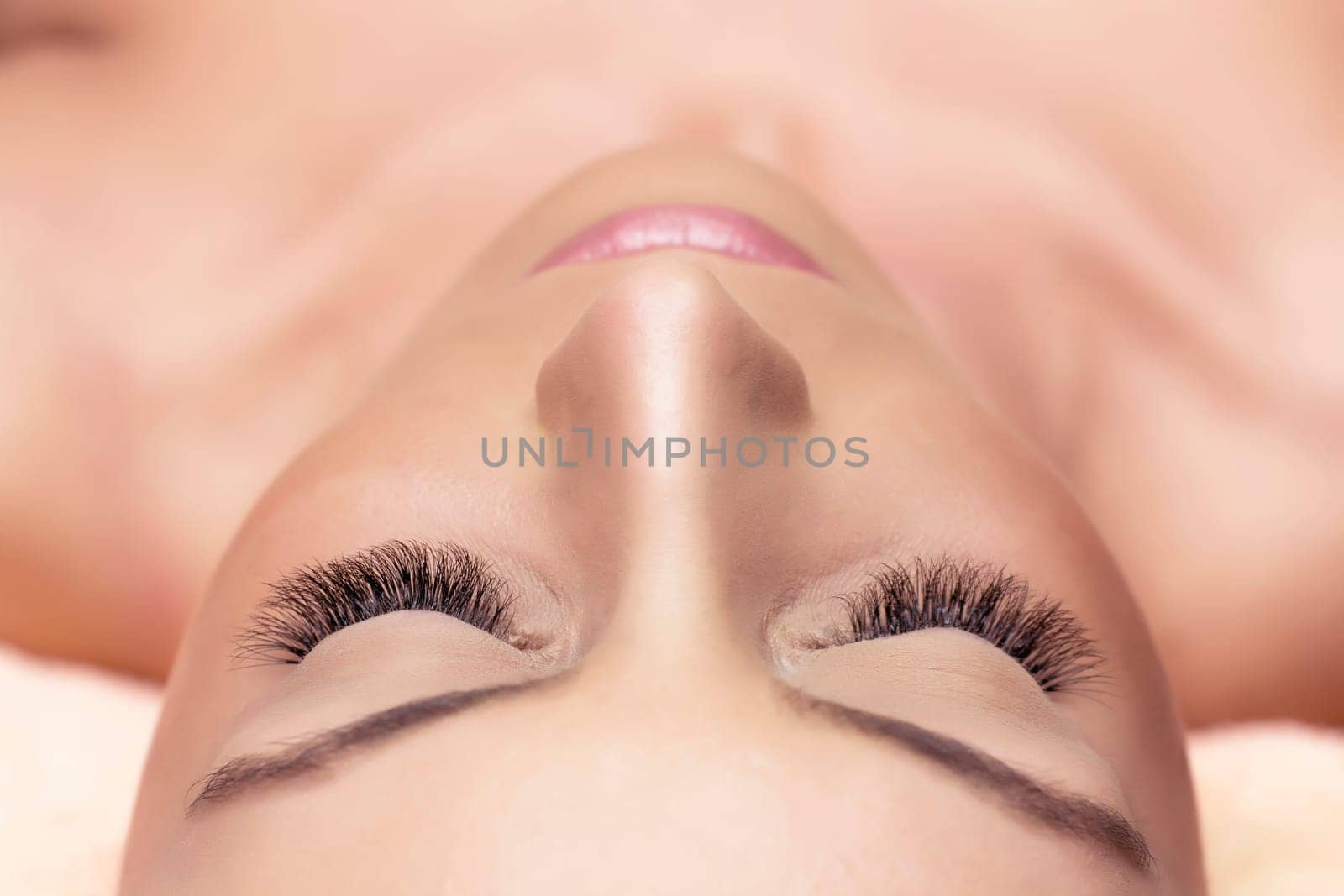 Treatment of Eyelash Extension. Lashes. Woman Eyes with Long Eyelashes.