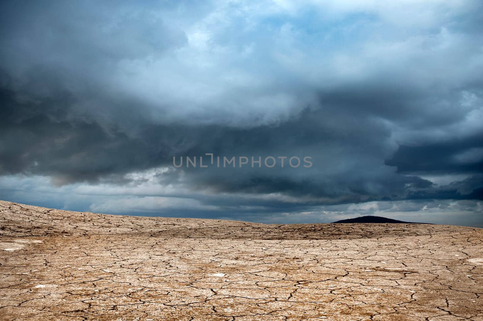 an image of mountain and cracked soil