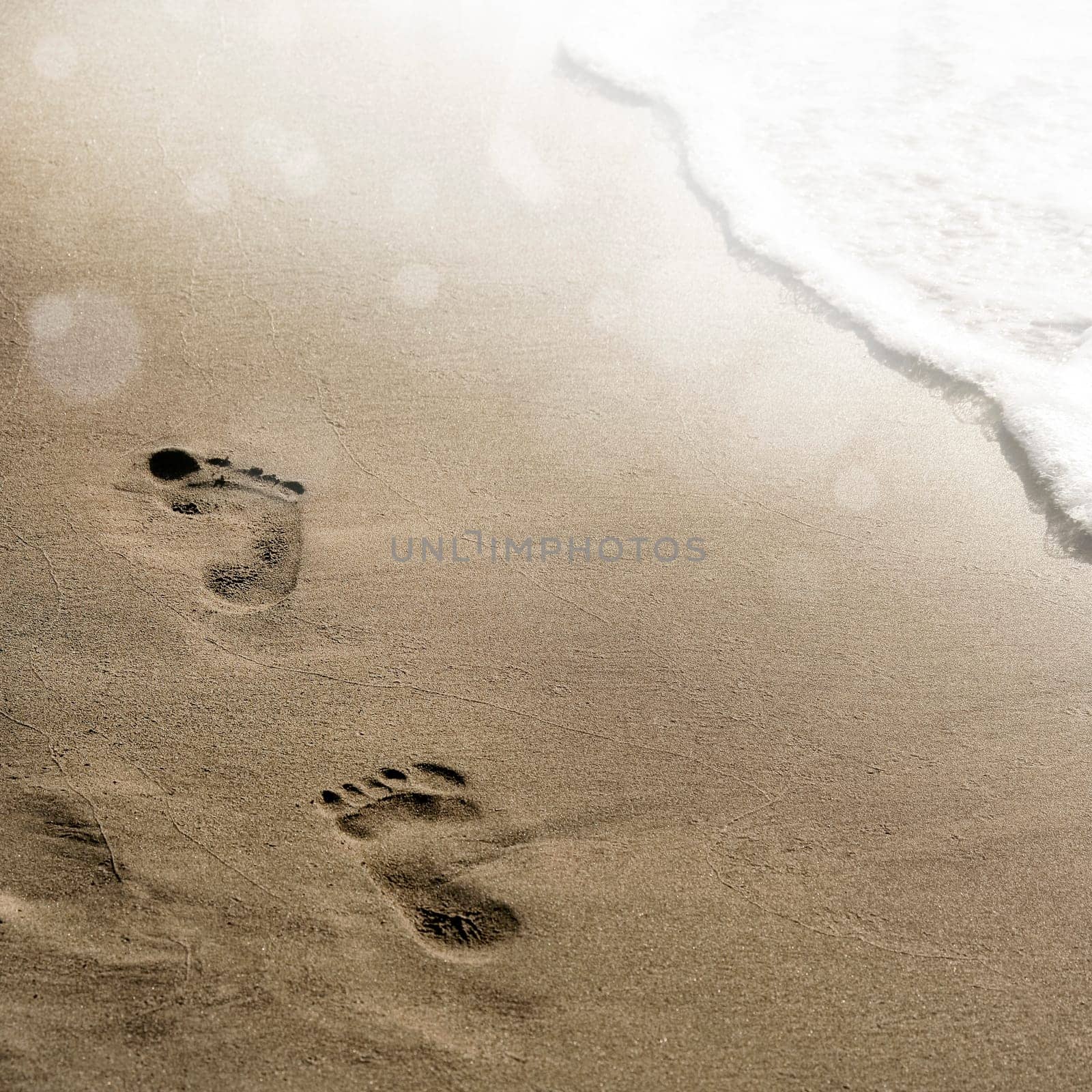 close up footprints on beach