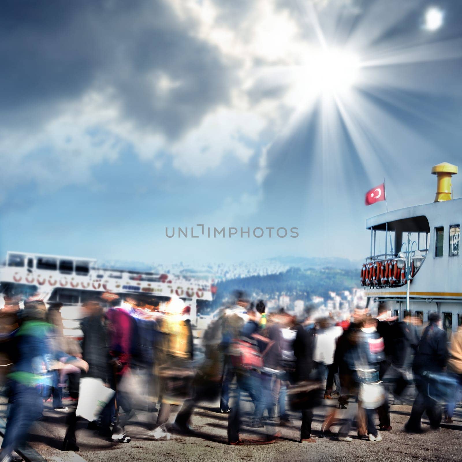 blurry background image of people walking to ferry boat