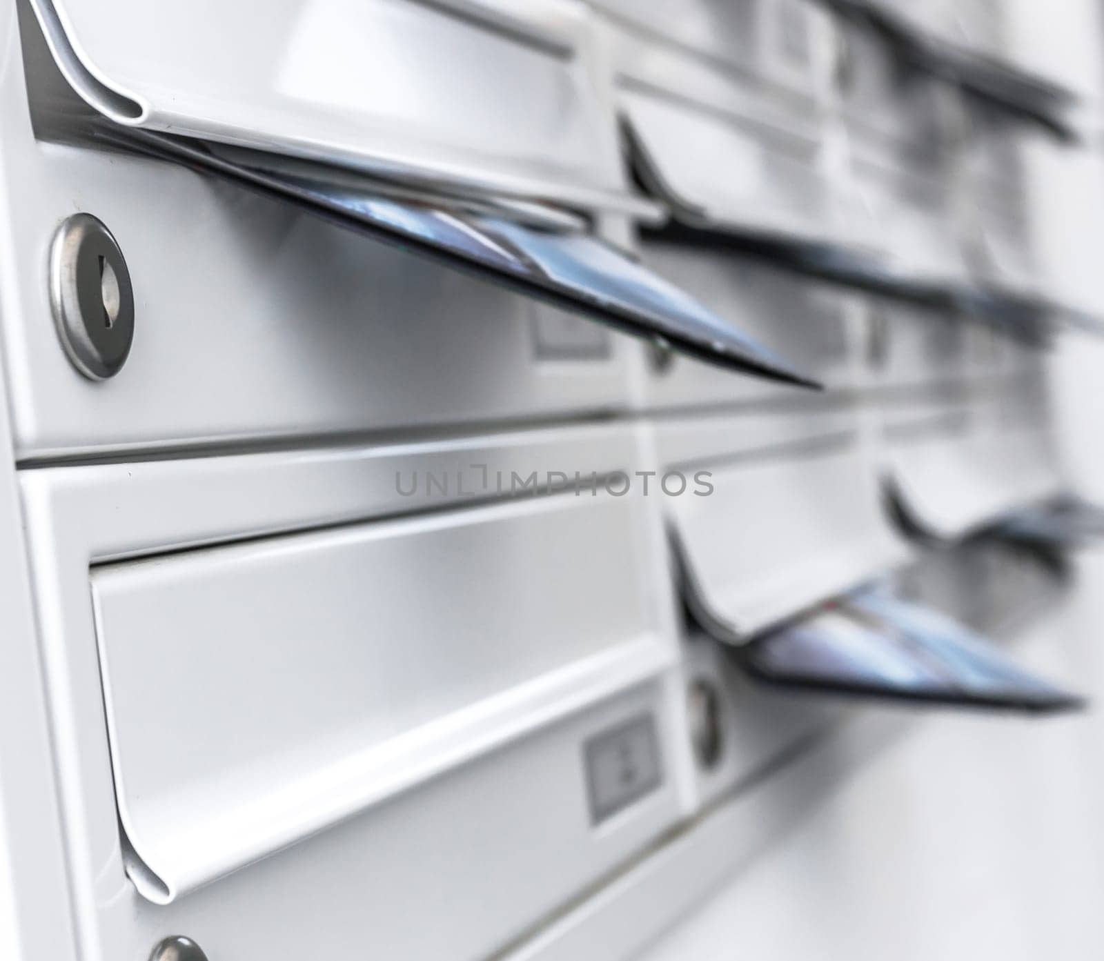 Modern mailboxes filled of leaflets. Business and advertising concepts. Shallow depth of field.