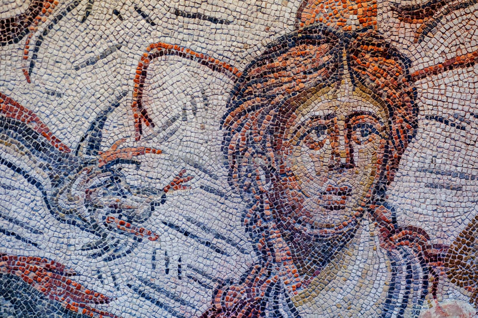 Jaen, Spain - December 29th, 2017: Roman Mosaic depicting sea-goddess Tethys at Jaen Museum. Fragment detail