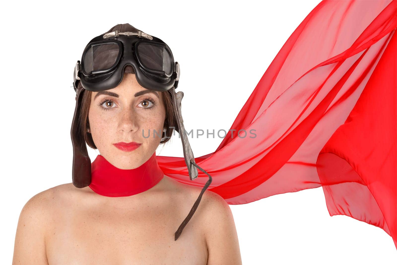 Beautiful girl with helmet and goggles blowing some rose petals