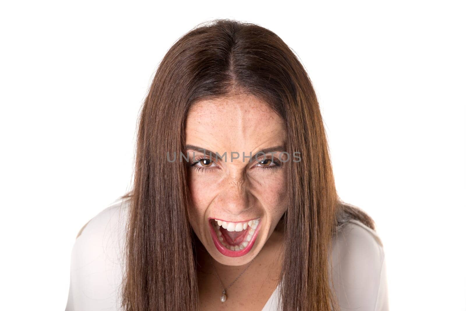 Angry casual young woman isolated in a white background