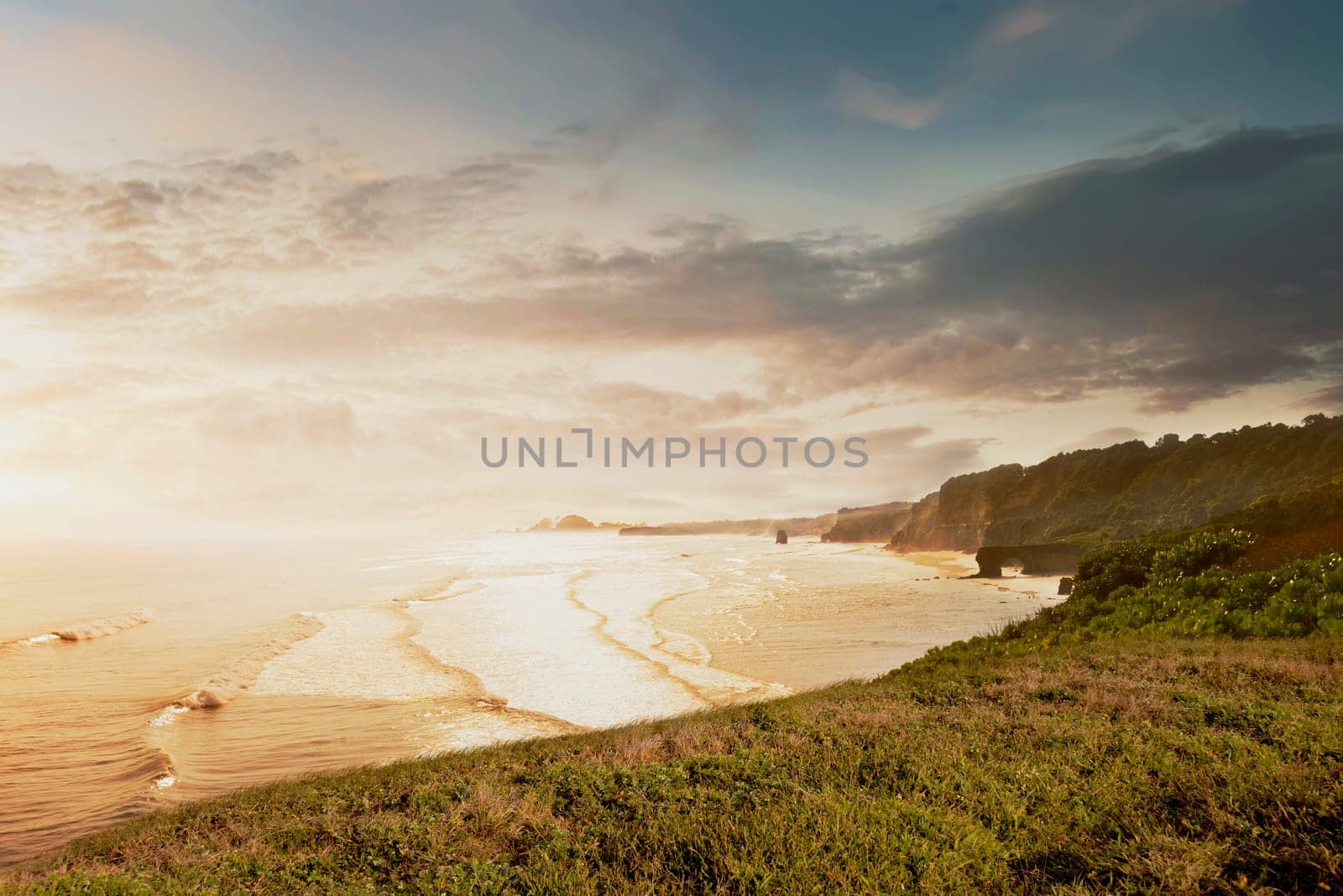 Ocean view with wave from cliff at sunset