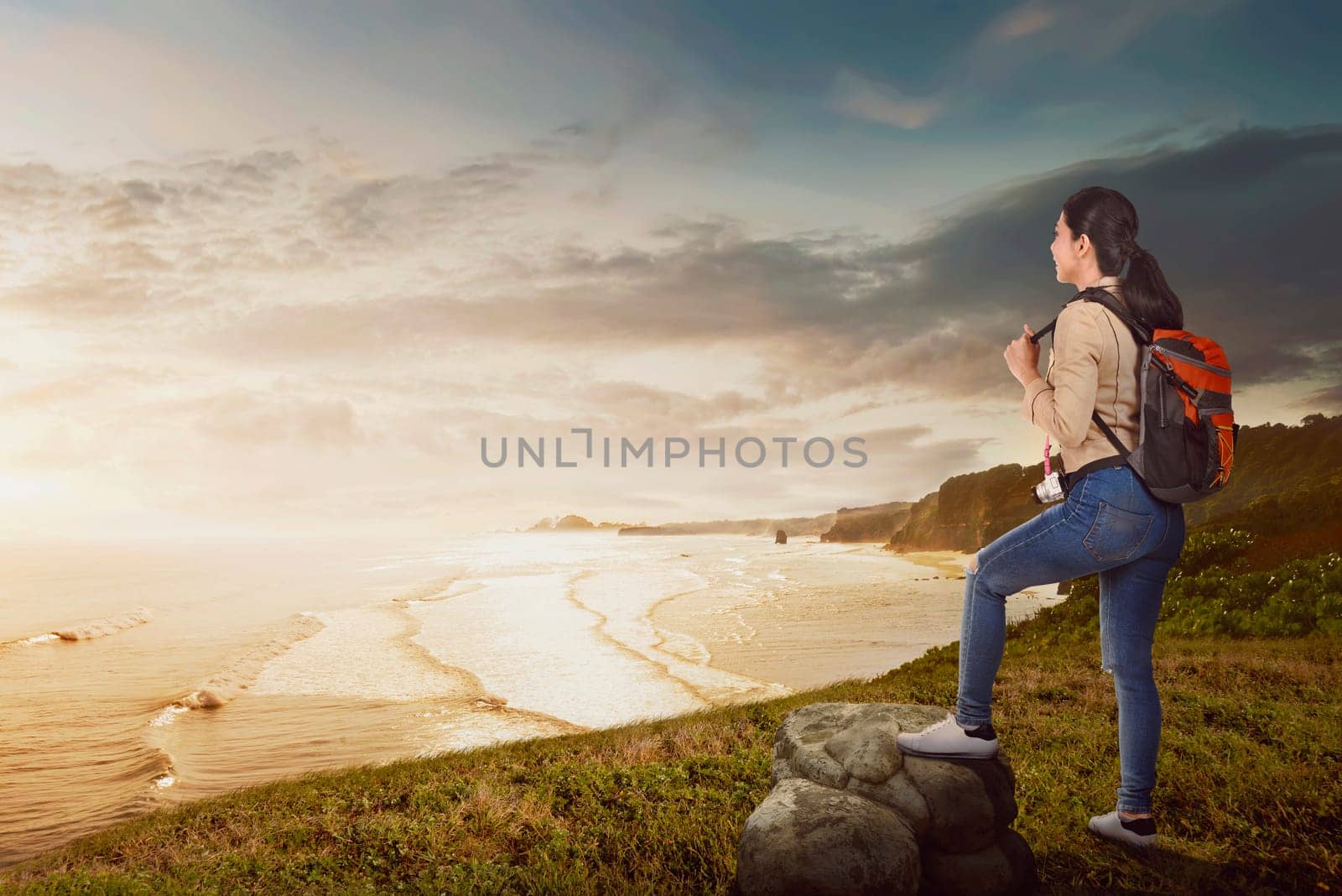 Young asian traveler woman enjoying panorama at sunset