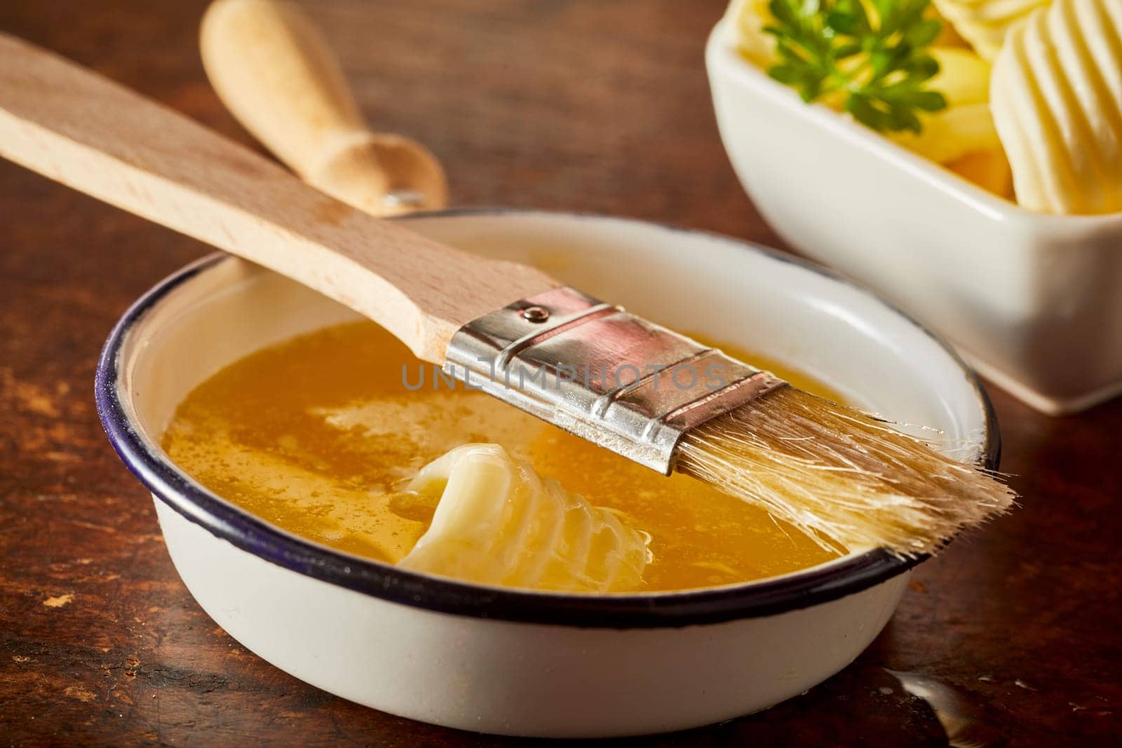 Baking food preparation scene with melted butter in a pan as an ingredient for cakes, bbq sauces and other cooking expriences.