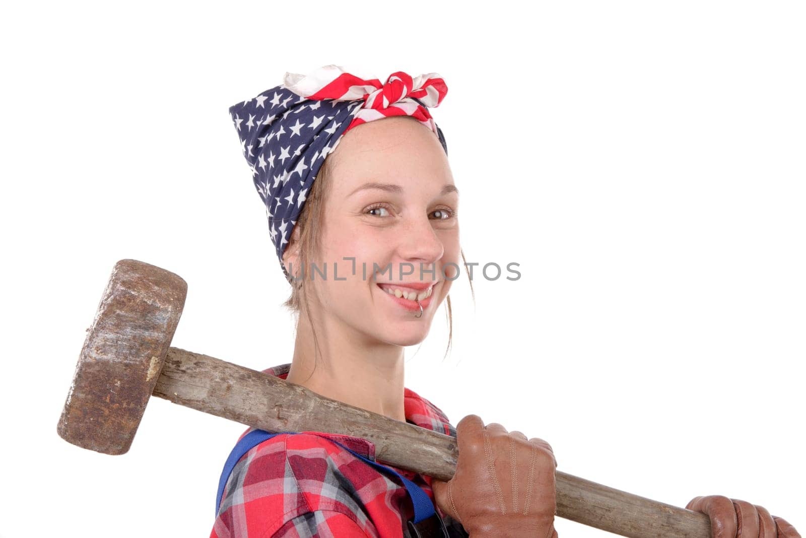 a pretty young working woman with a sledgehammer