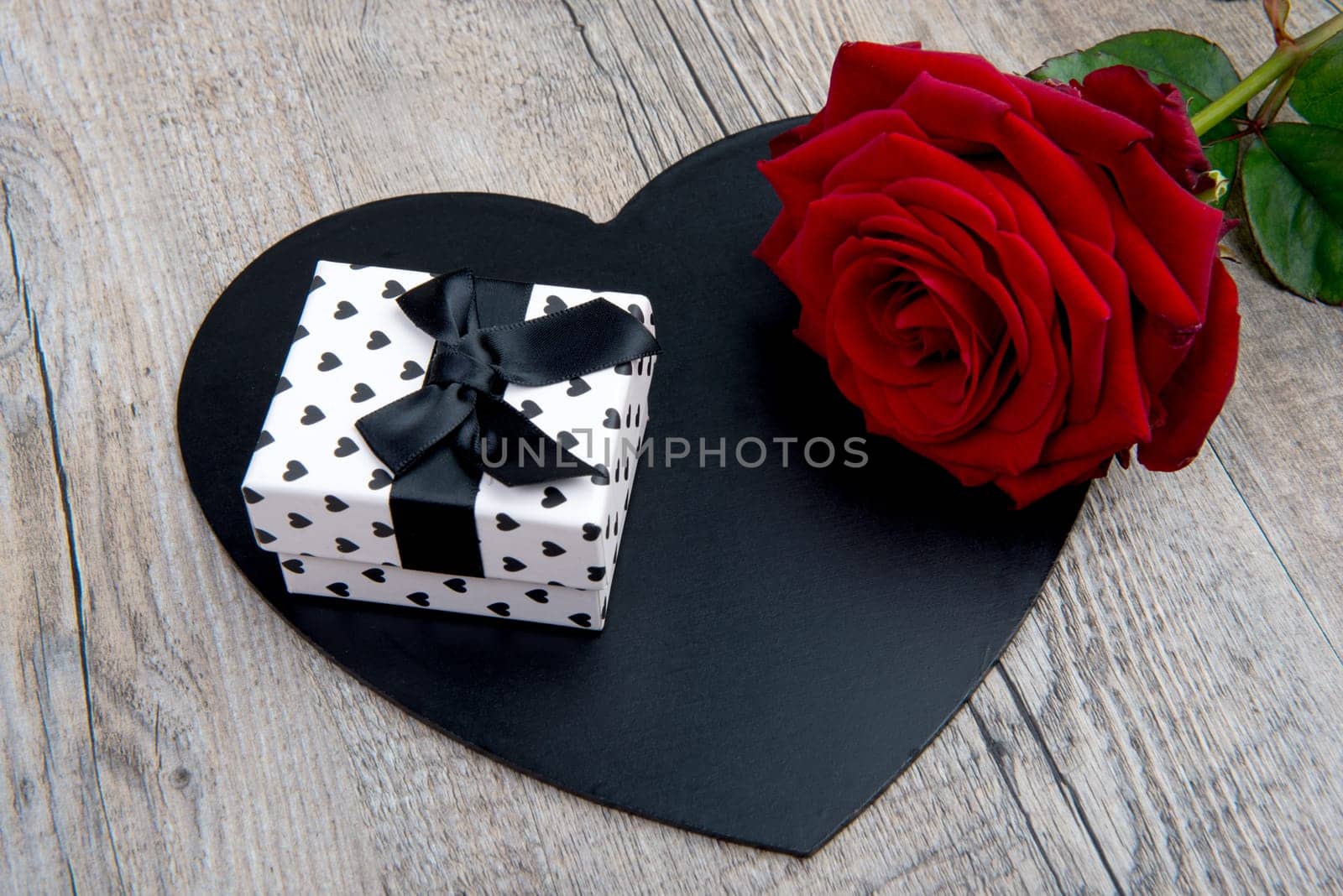 a heart, a rose and a gift for valentine day