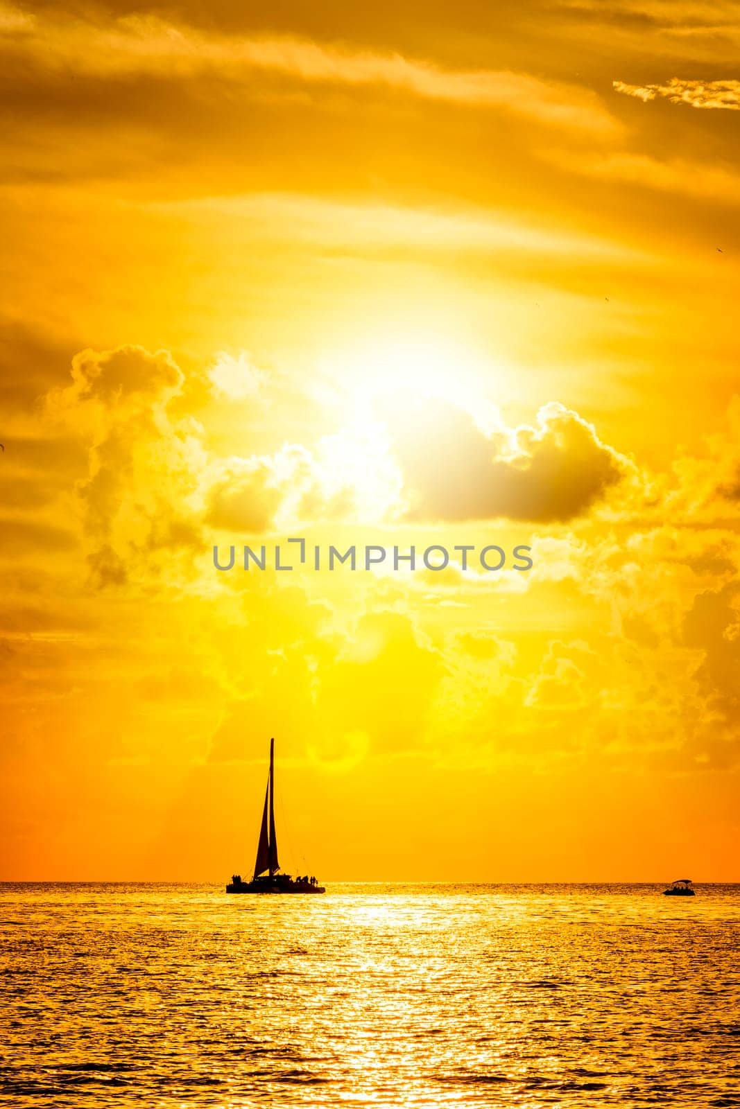 Sailboat and disherman in the sea at sunset, Key west bay, Floride, USA