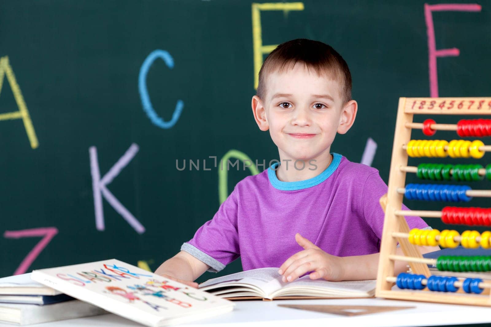 The boy goes to the first class at the school board
