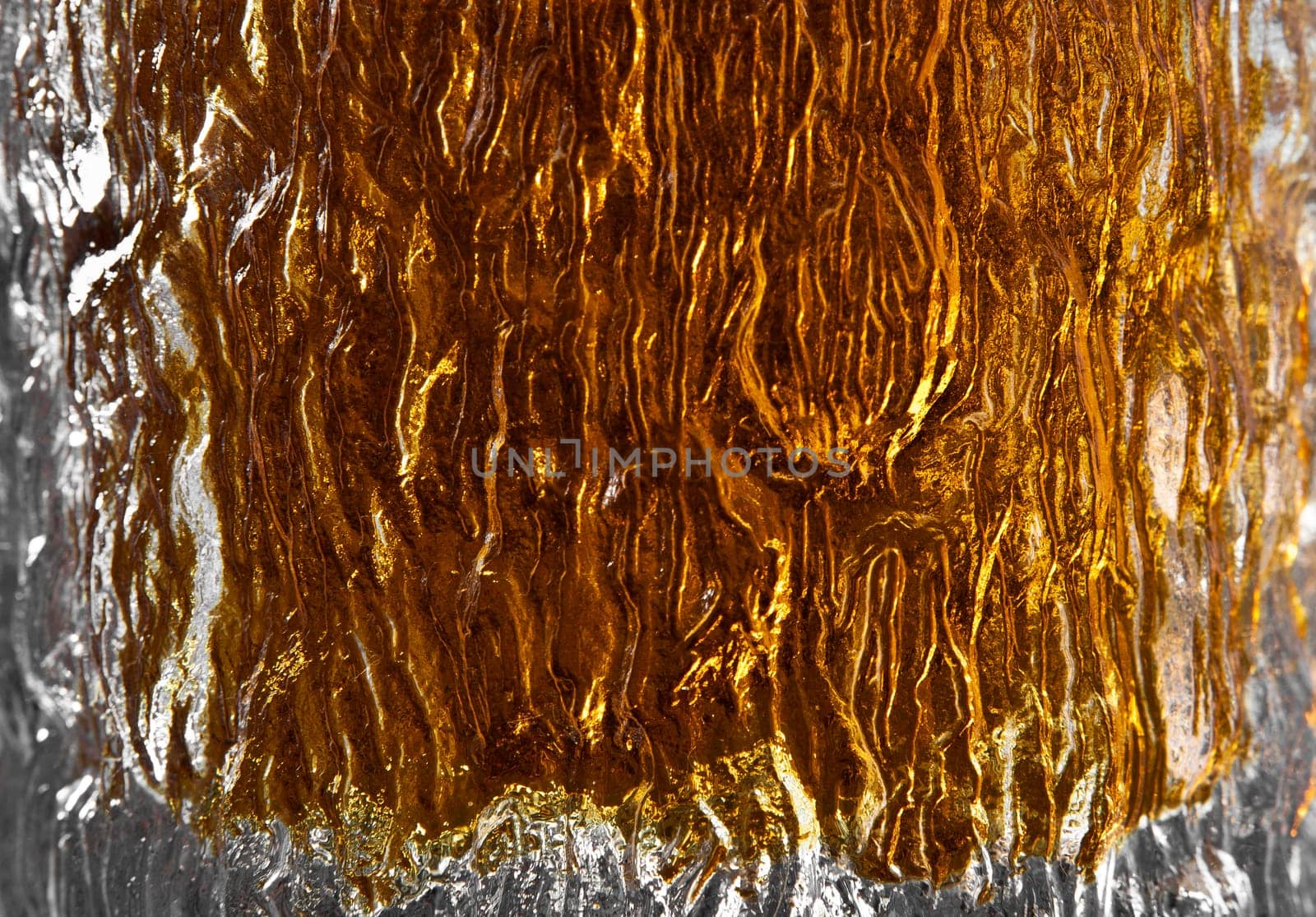Abstract detail shot of scotch in a glass ideal for backdrop or background