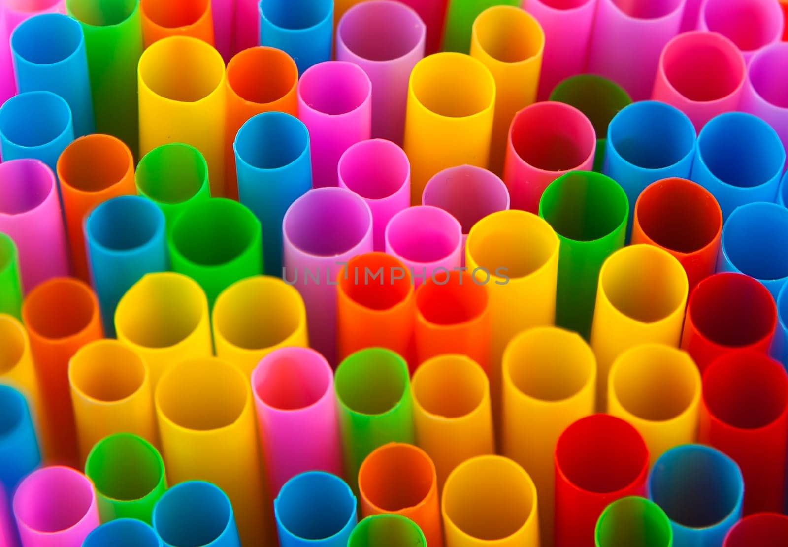 Conceptual image showing colourful drinking straws in macro