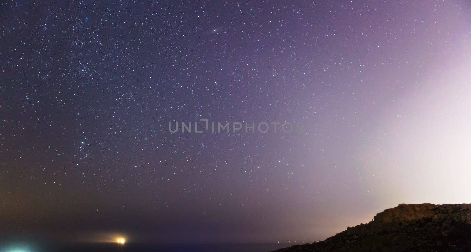 A misty Northern sky over Mgiebah Bay in Malta