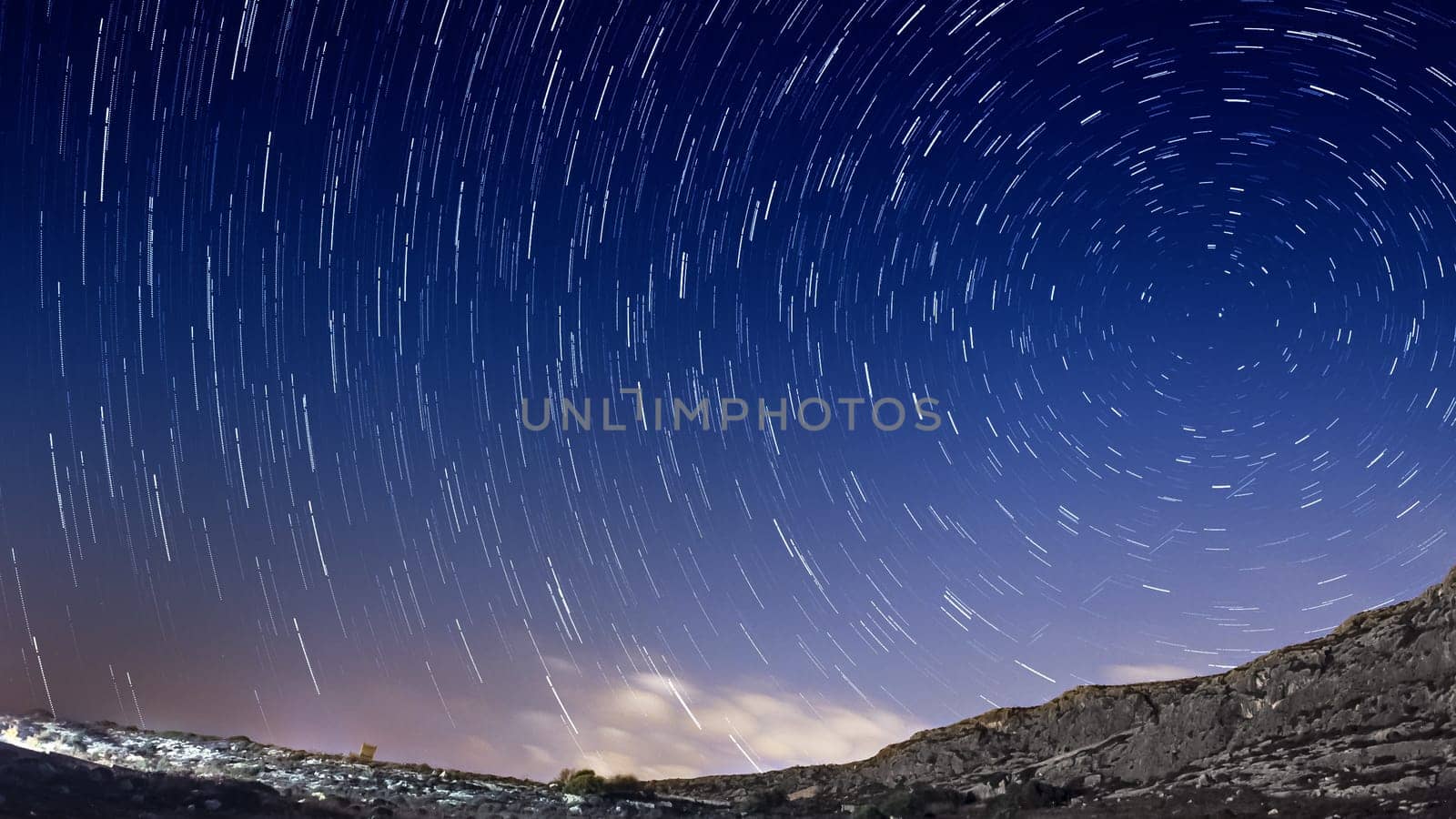 Extreme long exposure image showing star trails around the Polar Star or Polaris.