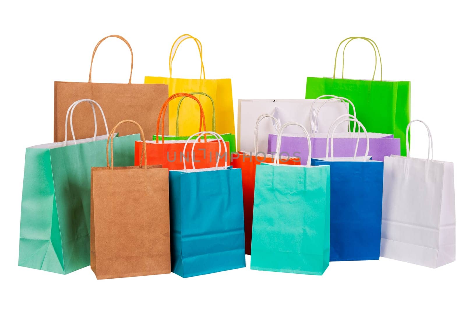 Variety of colored paper shopping bags on white background. Empty area.
