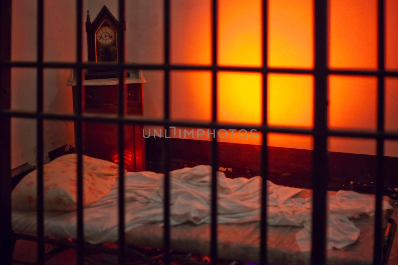 Empty bed in an eerie and spooky prison cell