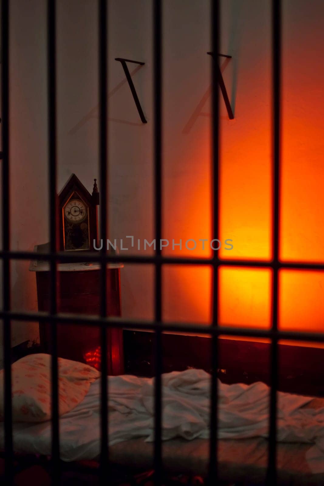 Empty bed in an eerie and spooky prison cell
