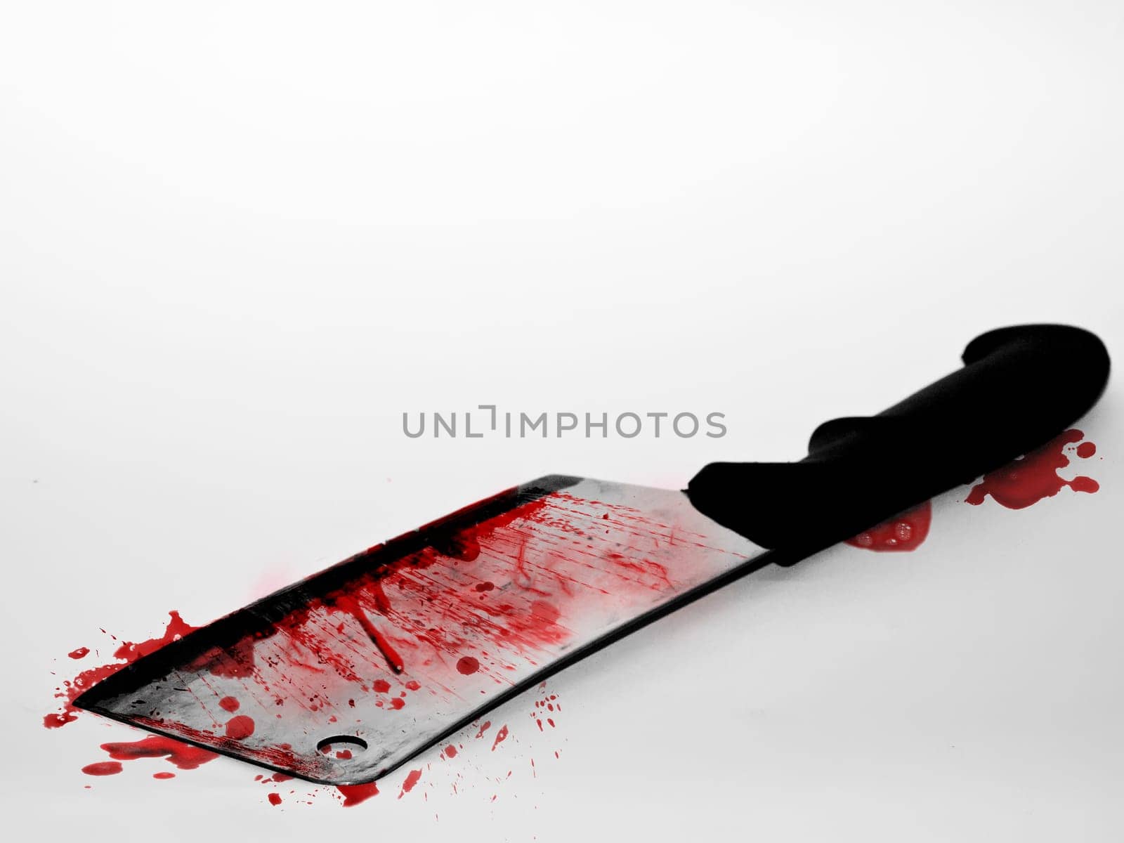 Cleaving knife over white backdrop