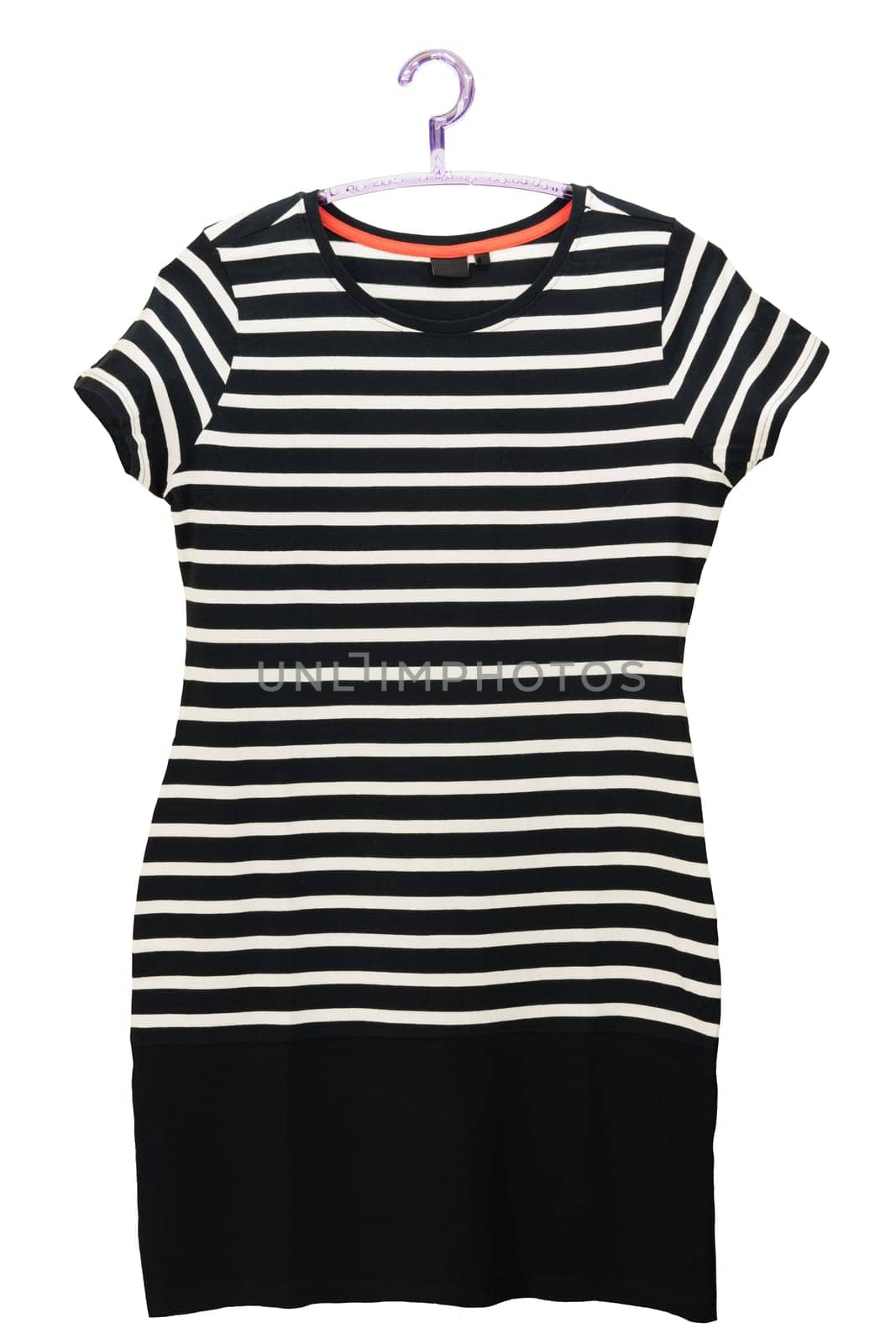 Fashionable summer clothes isolated on a white background. Black and white striped womans dress in marine style. Dress on a hanger. Summer fashion.