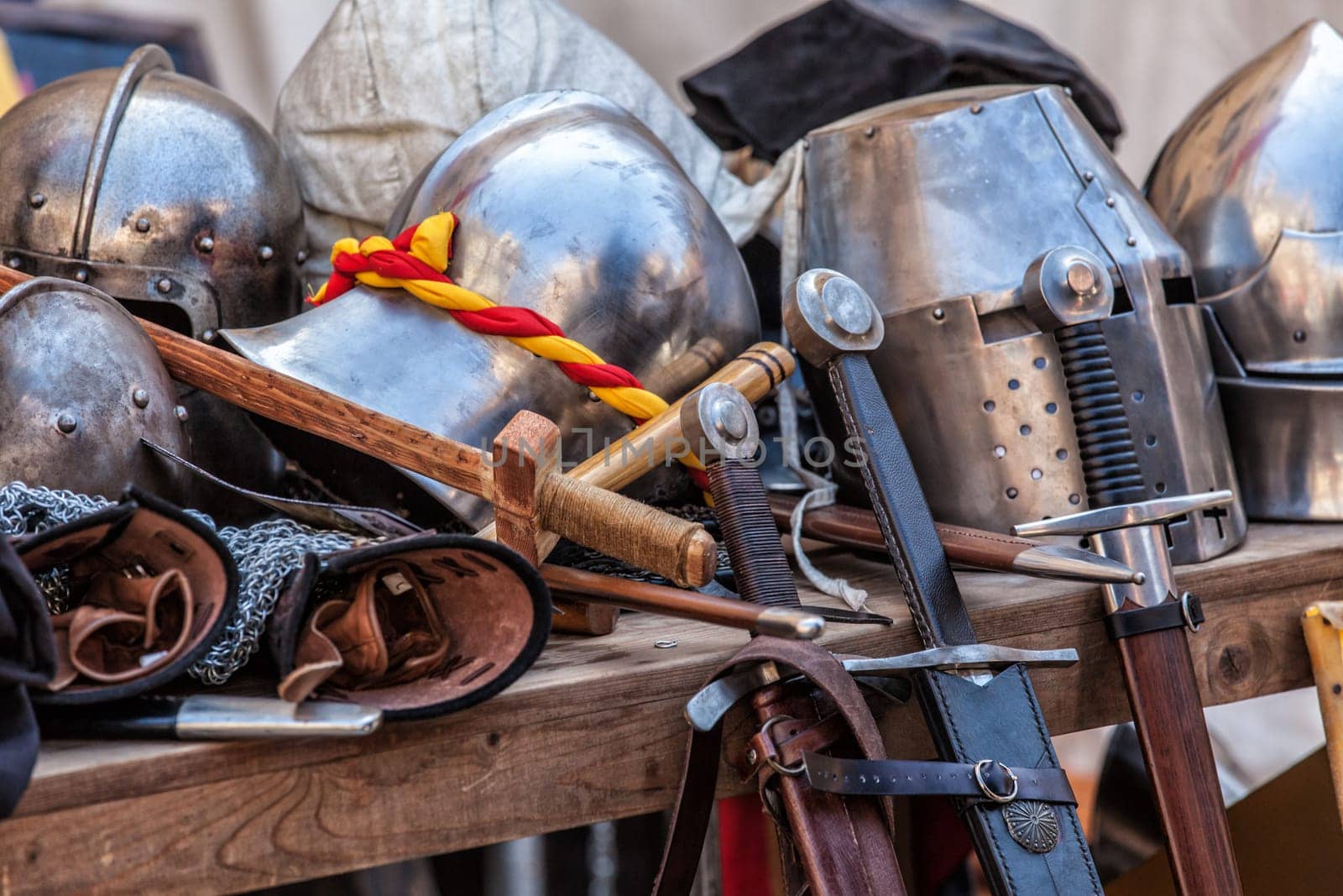 Table with various pieces of medieval armour