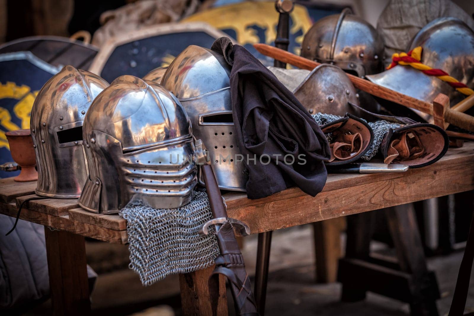 Table with various pieces of medieval armour