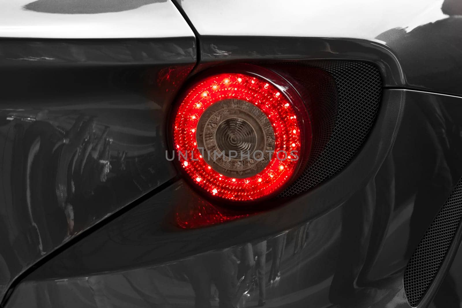 Abstract image showing detail from the rear bodywork of a supercar