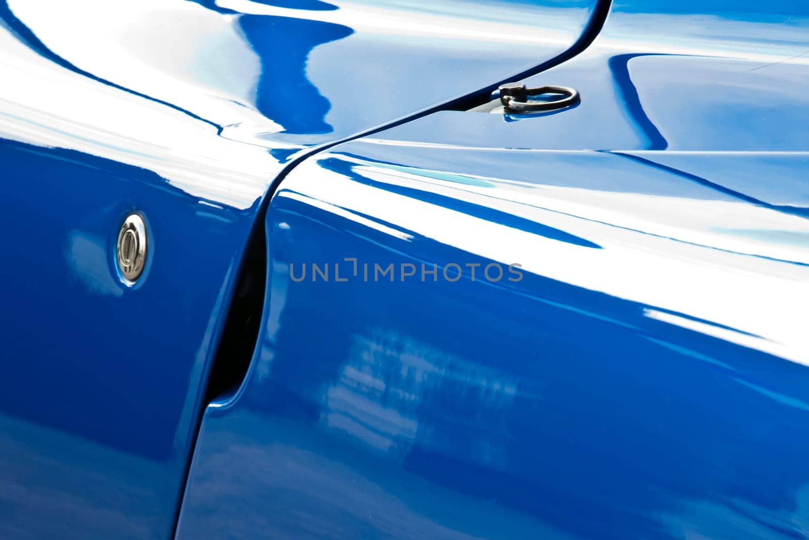 Abstract image showing detail form a blue sportscar