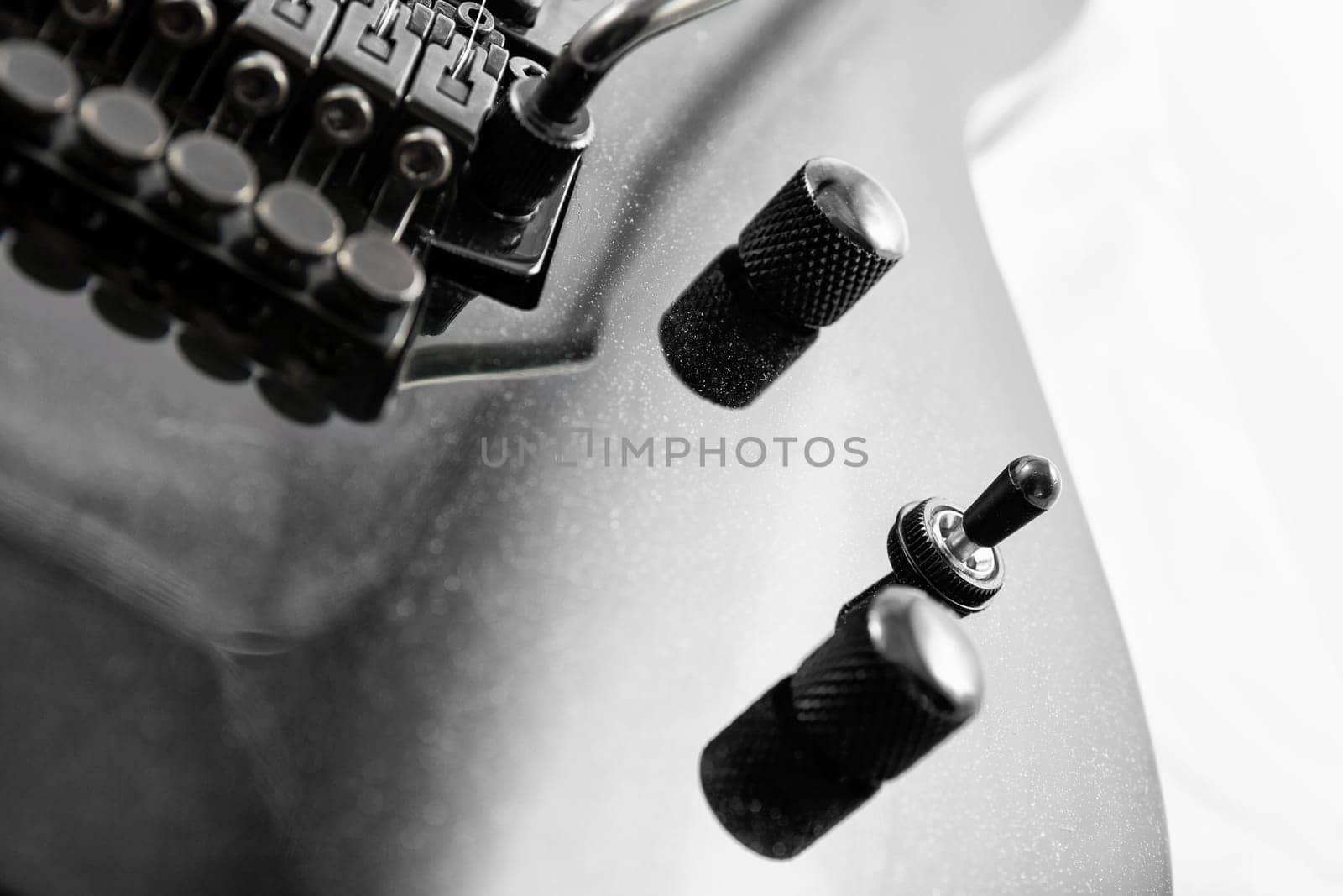 Electric guitar detail shots over white backdrop