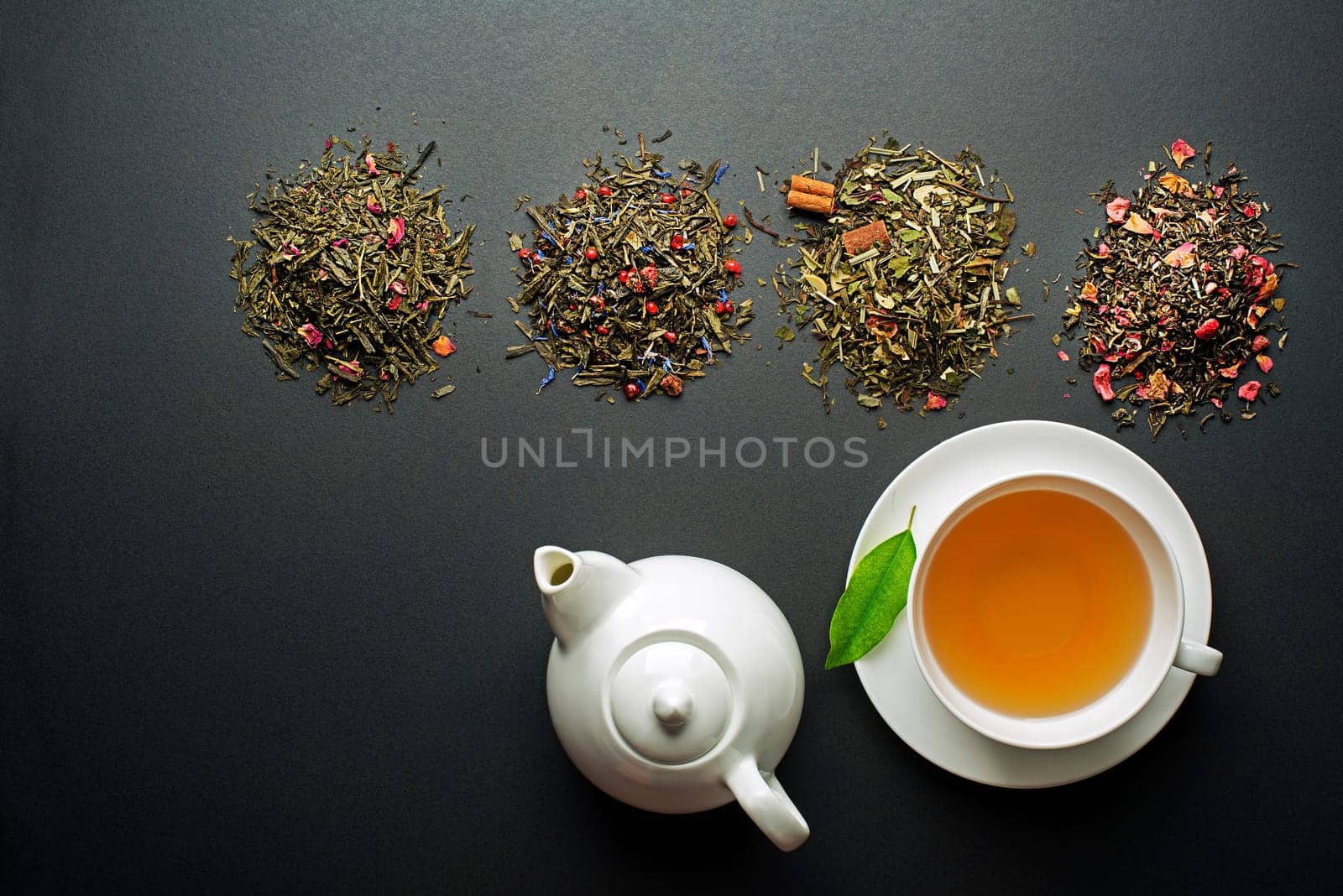 Cup of tea with dry tea collection of different types