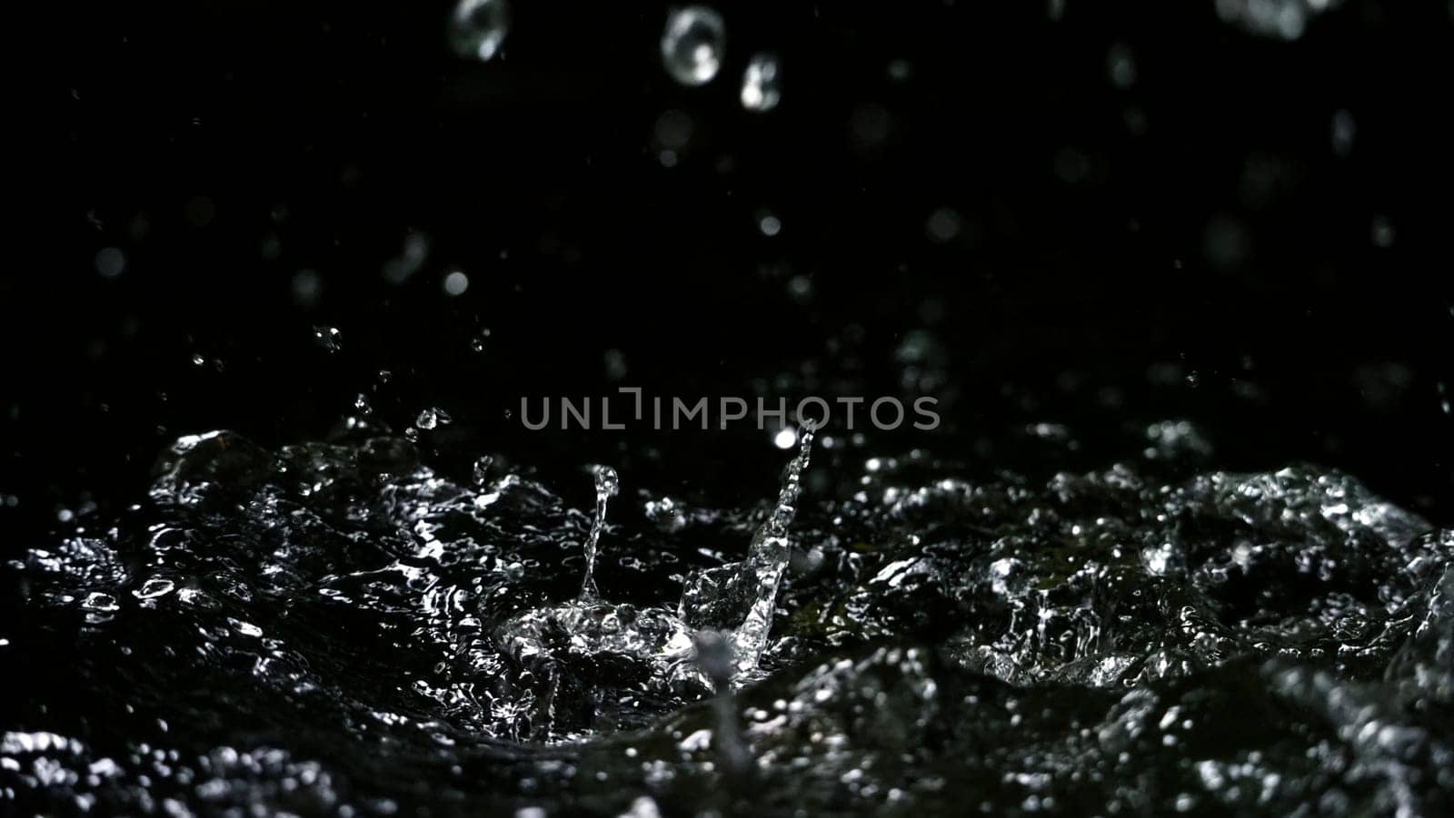 Water splash on black background color which represent clean and pure natural freshness of liquid for healthy drink or sparkling water