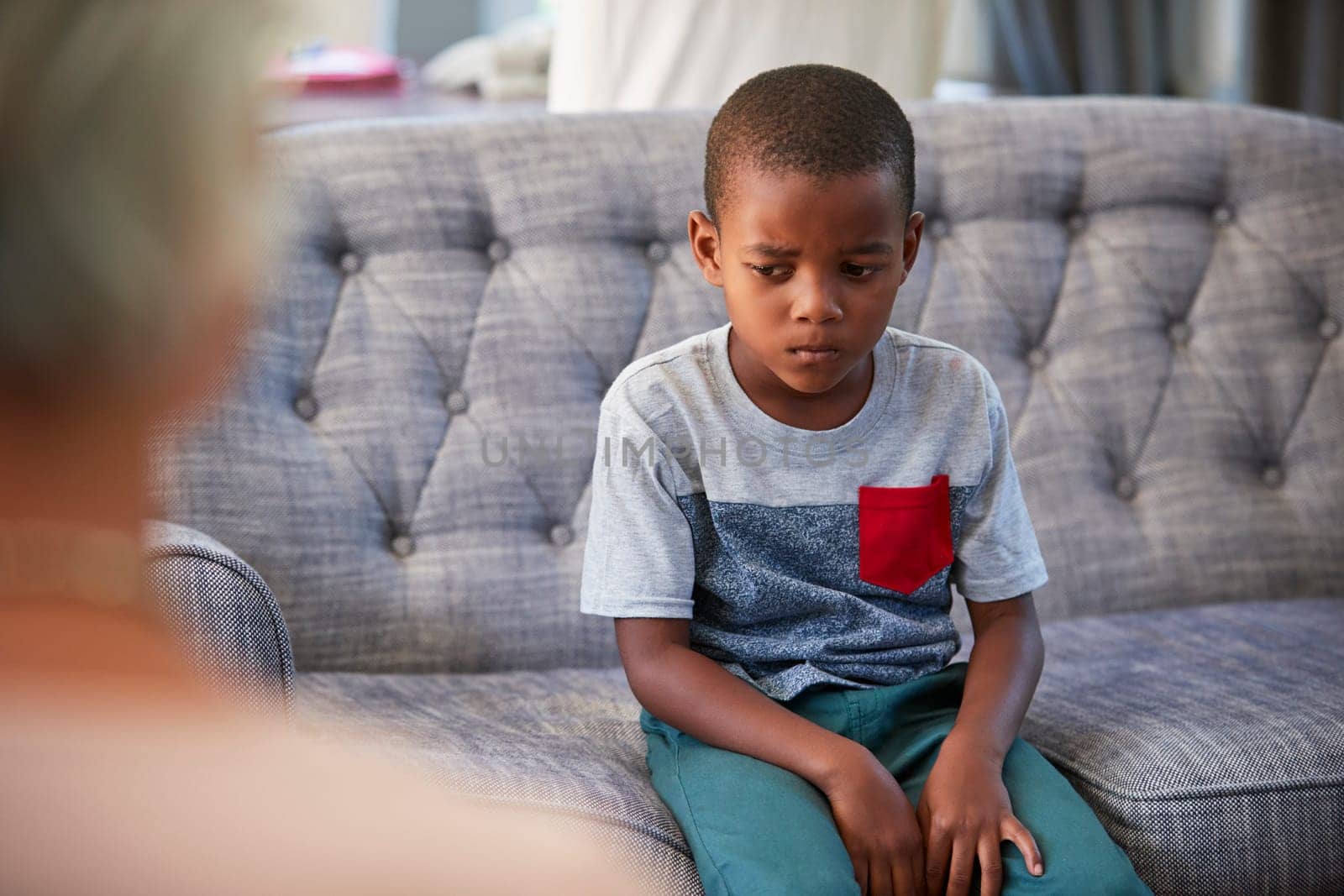 Young boy having therapy with a child psychologist