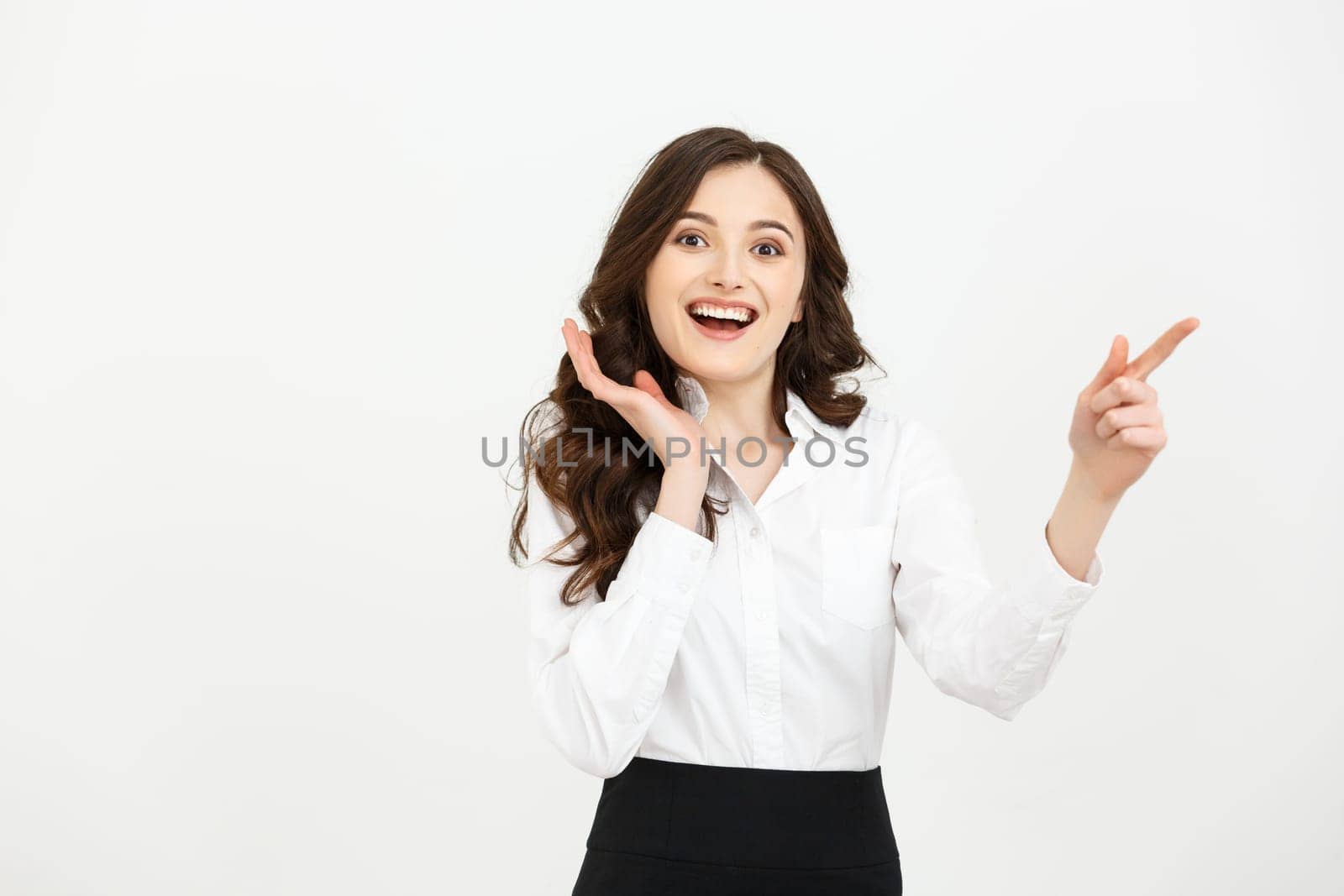 Business Concept Portrait of smiling business woman pointing finger on copy space. iswolated portrait