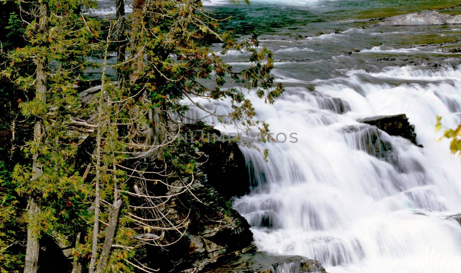 Waterfall and cascades on river