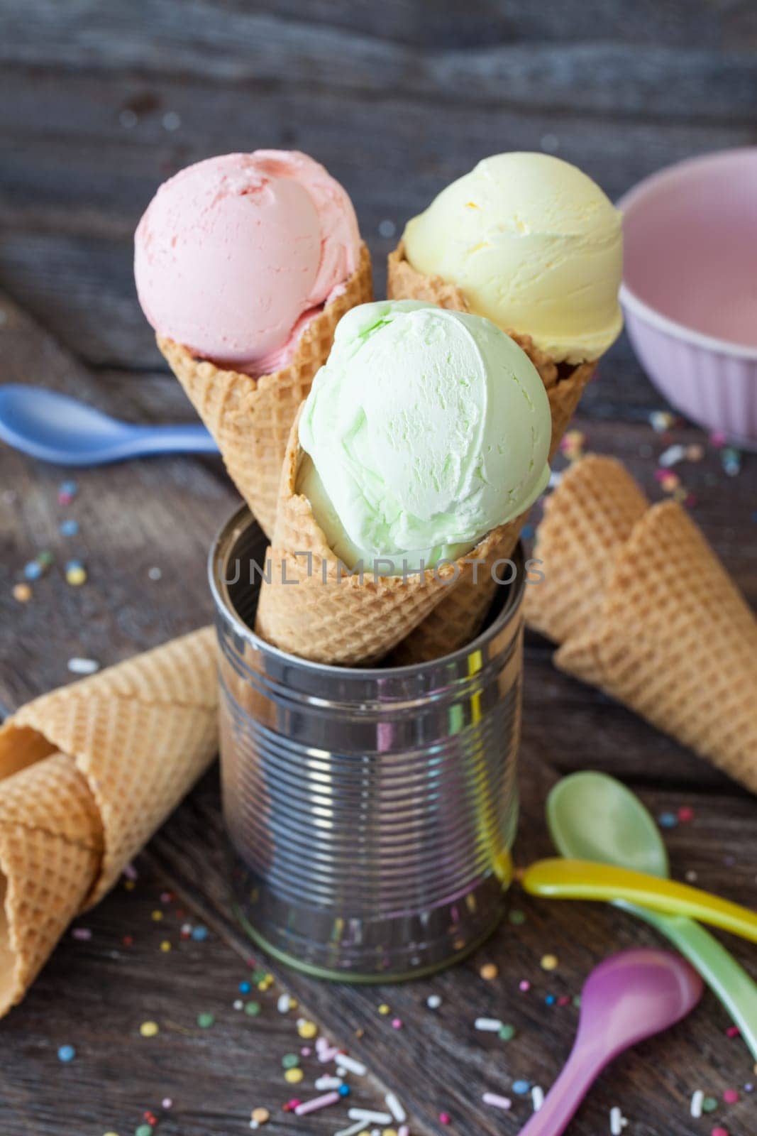 Colorful ice cream balls in waffle cloths with sugar sprinkles