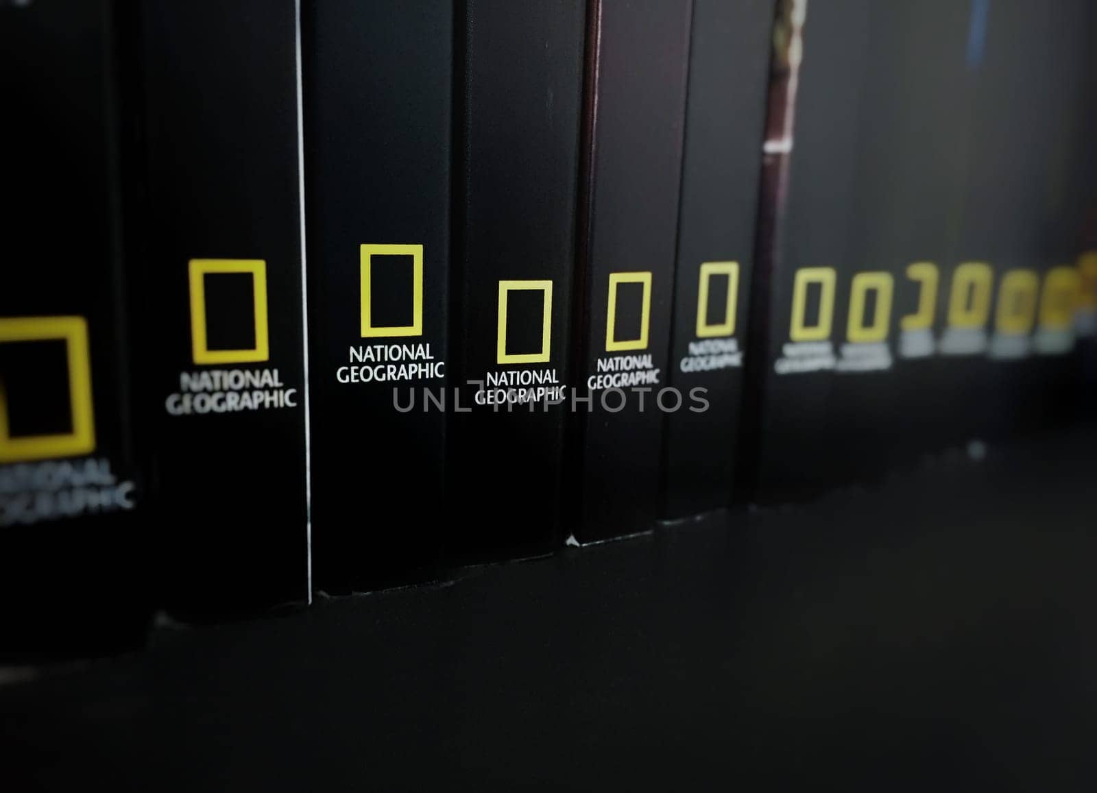 Rome, italy, June 29th 2018: spines of Black books stored in a shelf with the National Geographic logo
