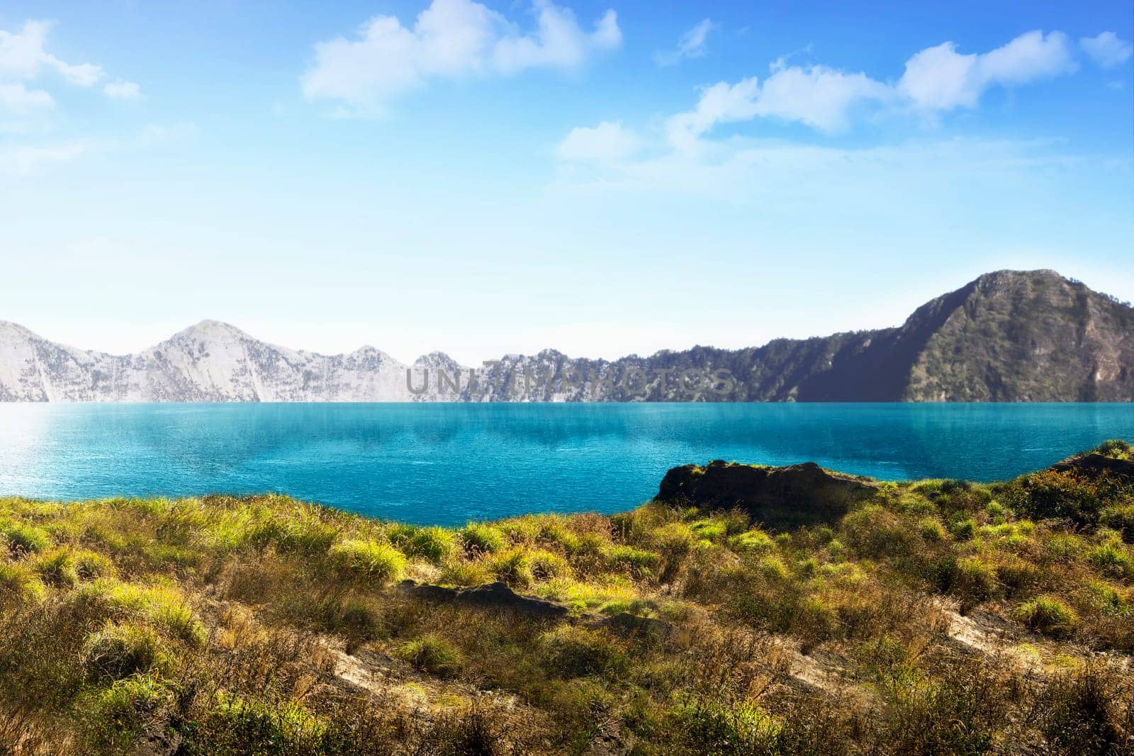 Beautiful lake with mountain view on background at sunny day