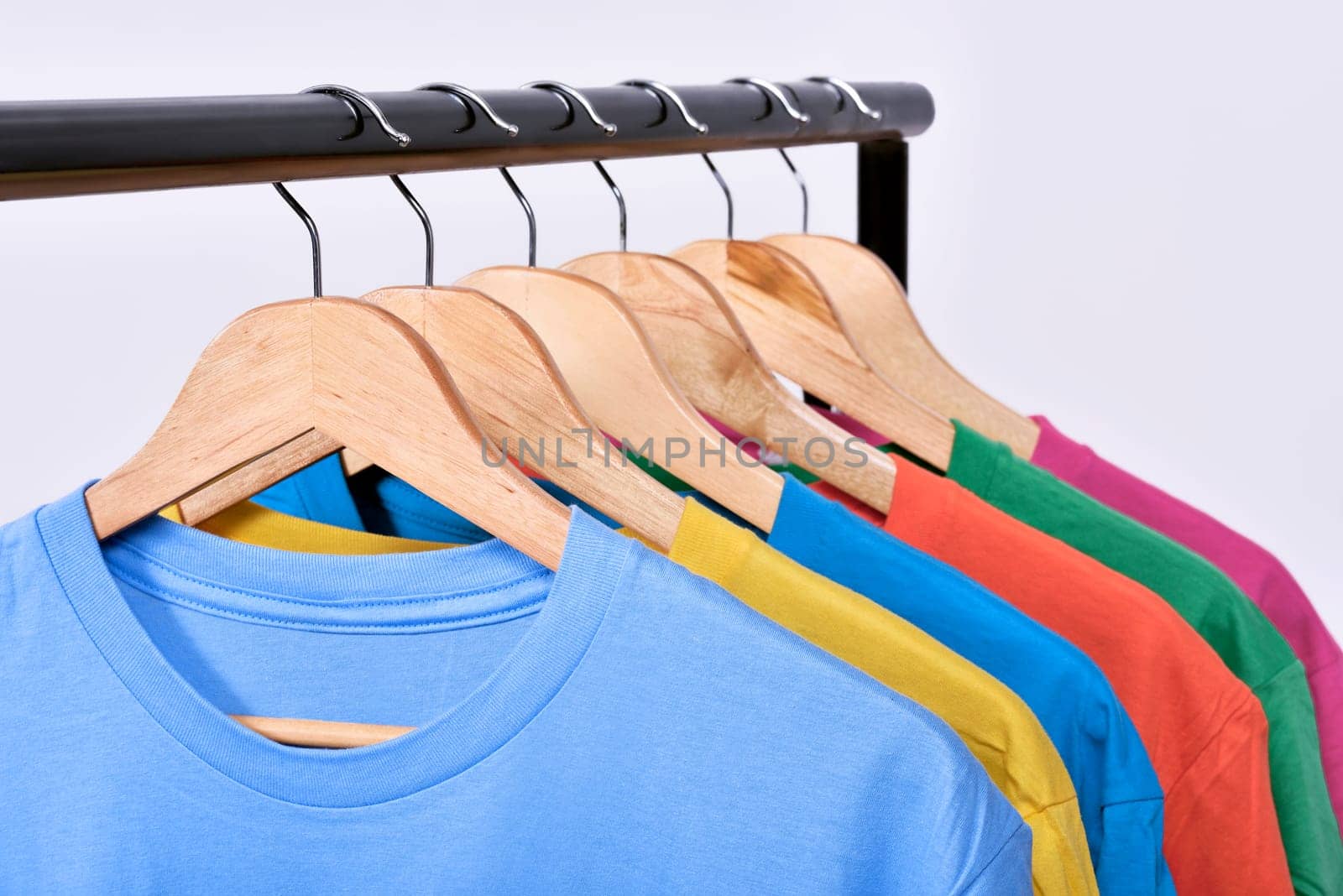 Clothes hang on a shelf after washing isolated over white background