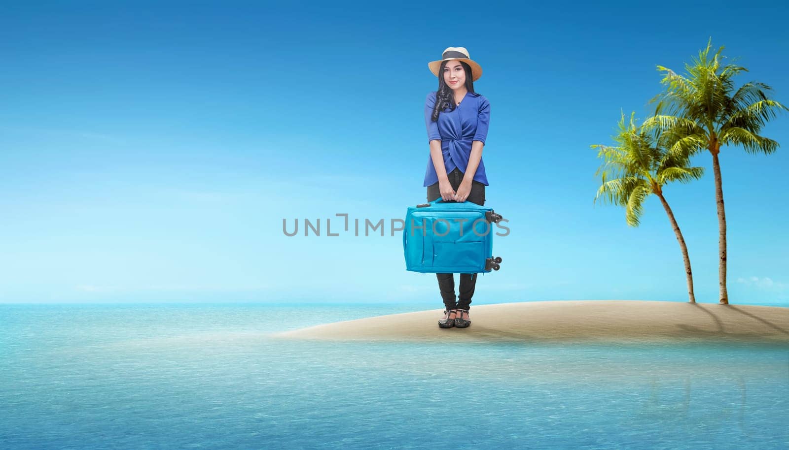 Beautiful asian traveler woman with suitcase standing on island