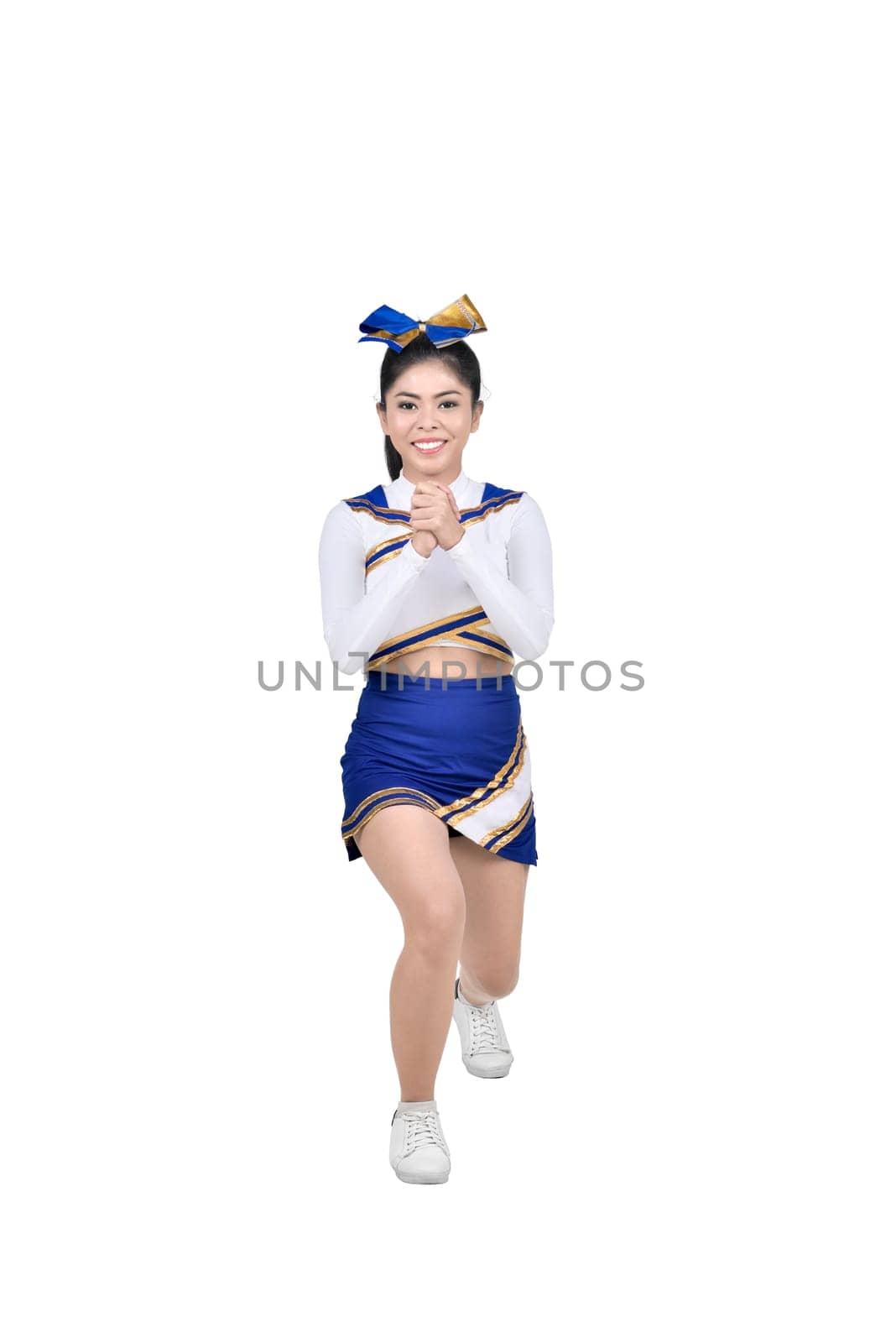 Attractive asian cheerleader in action posing isolated over white background