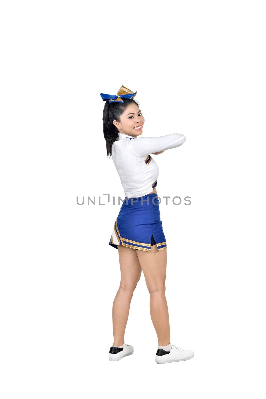 Attractive asian cheerleader in action posing isolated over white background