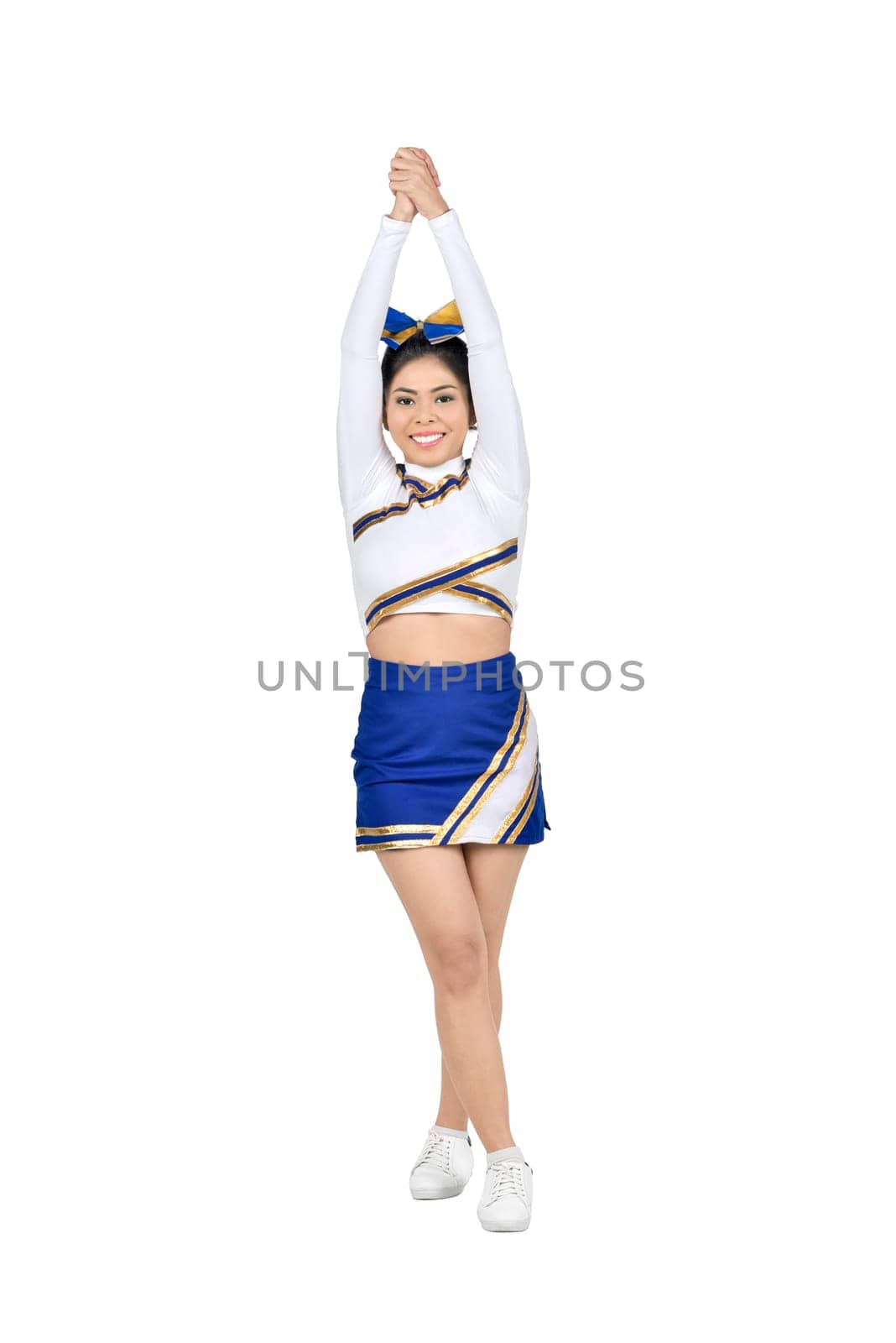 Attractive asian cheerleader in action posing isolated over white background