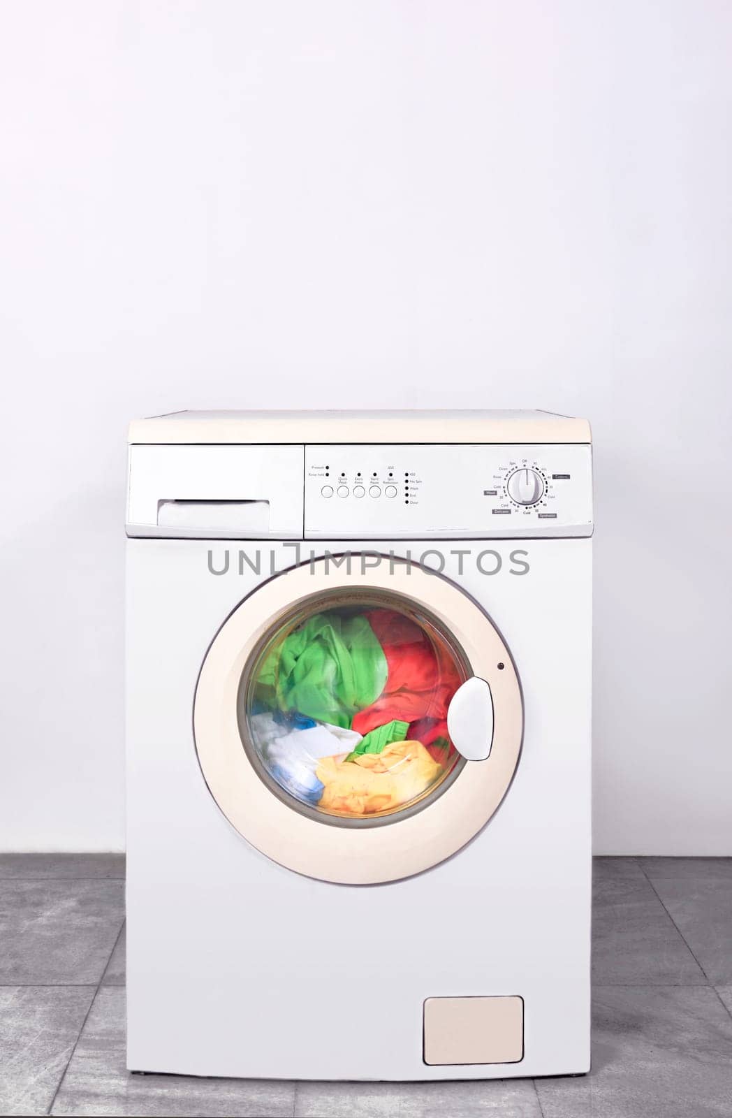 Dirty clothes washed on washing machine. Home appliances