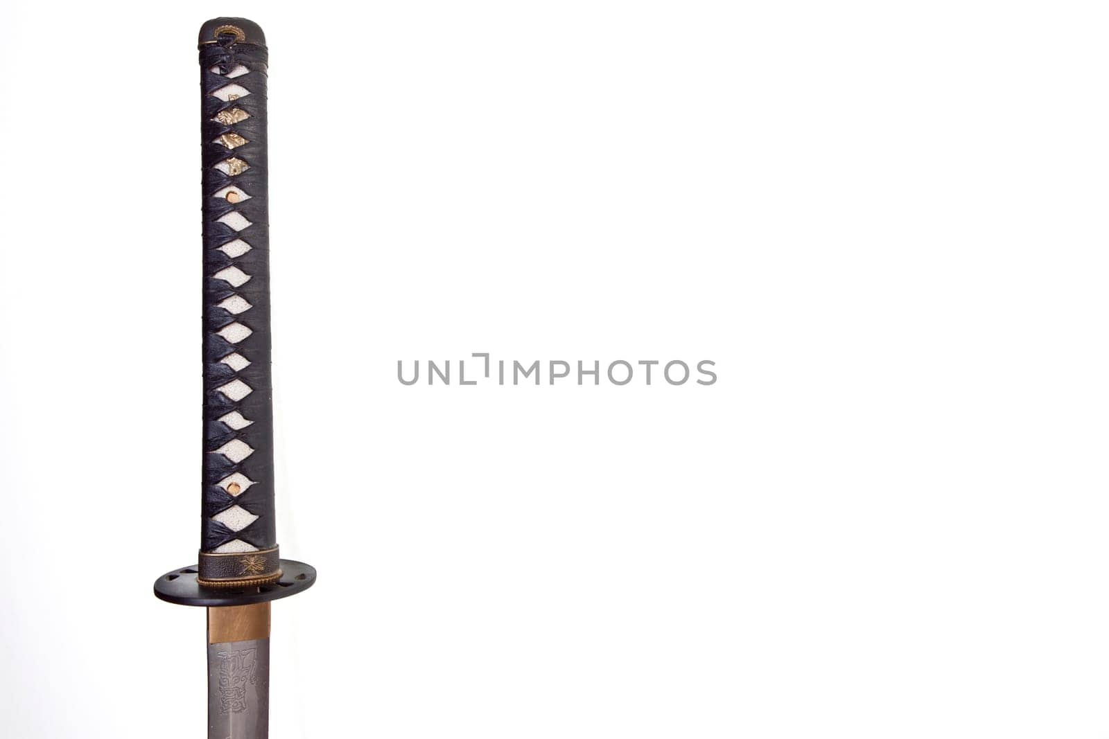 Detail from the very sharp steel blade on a Japanese Samurai sword or Katana.  The blade has to be constantly kept waxed to protect against oxidization and to retain sharpness.