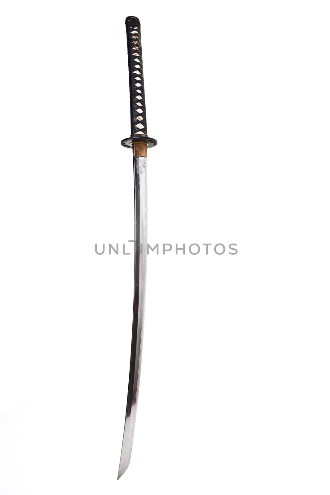 Detail from the very sharp steel blade on a Japanese Samurai sword or Katana.  The blade has to be constantly kept waxed to protect against oxidization and to retain sharpness.