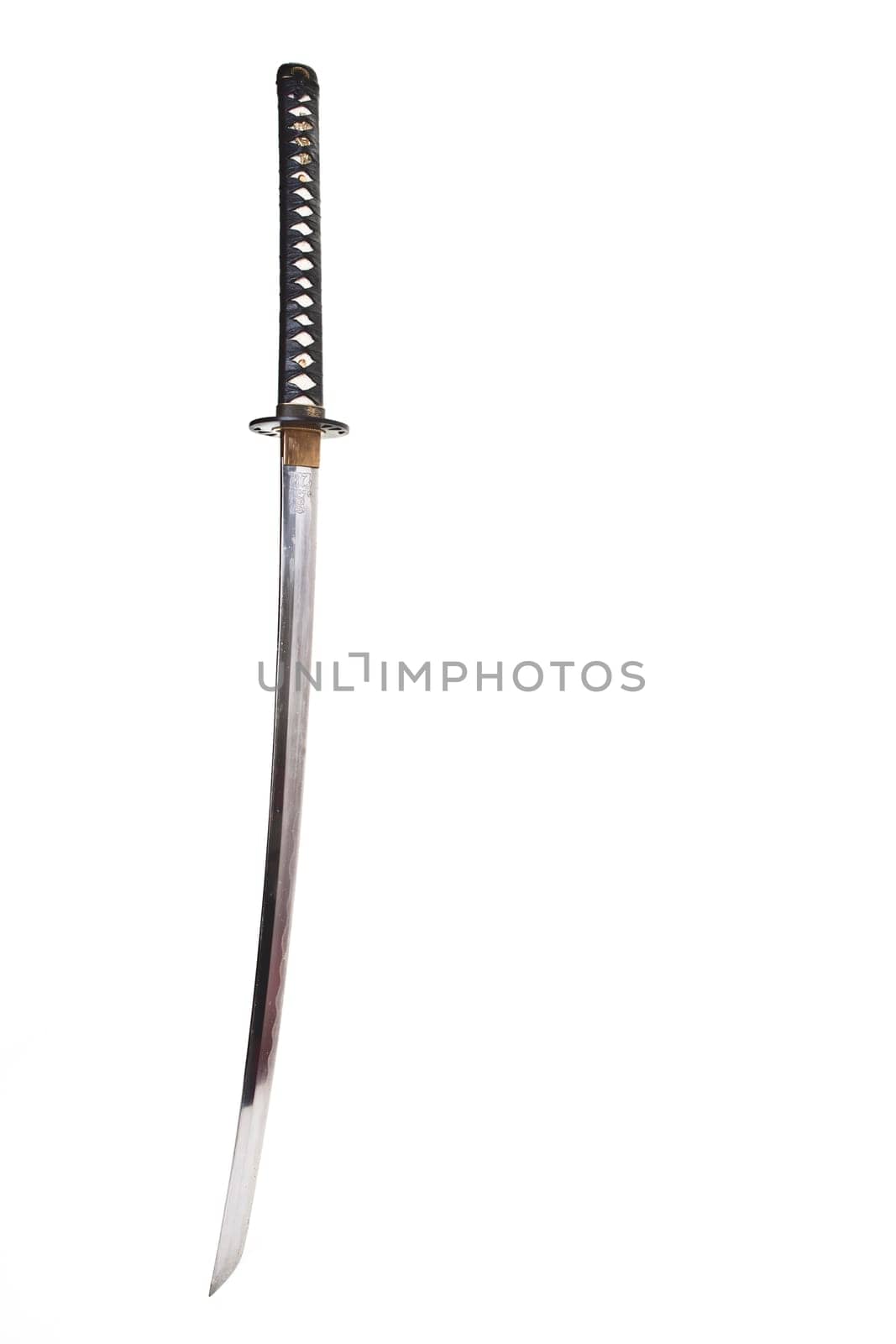 Detail from the very sharp steel blade on a Japanese Samurai sword or Katana.  The blade has to be constantly kept waxed to protect against oxidization and to retain sharpness.