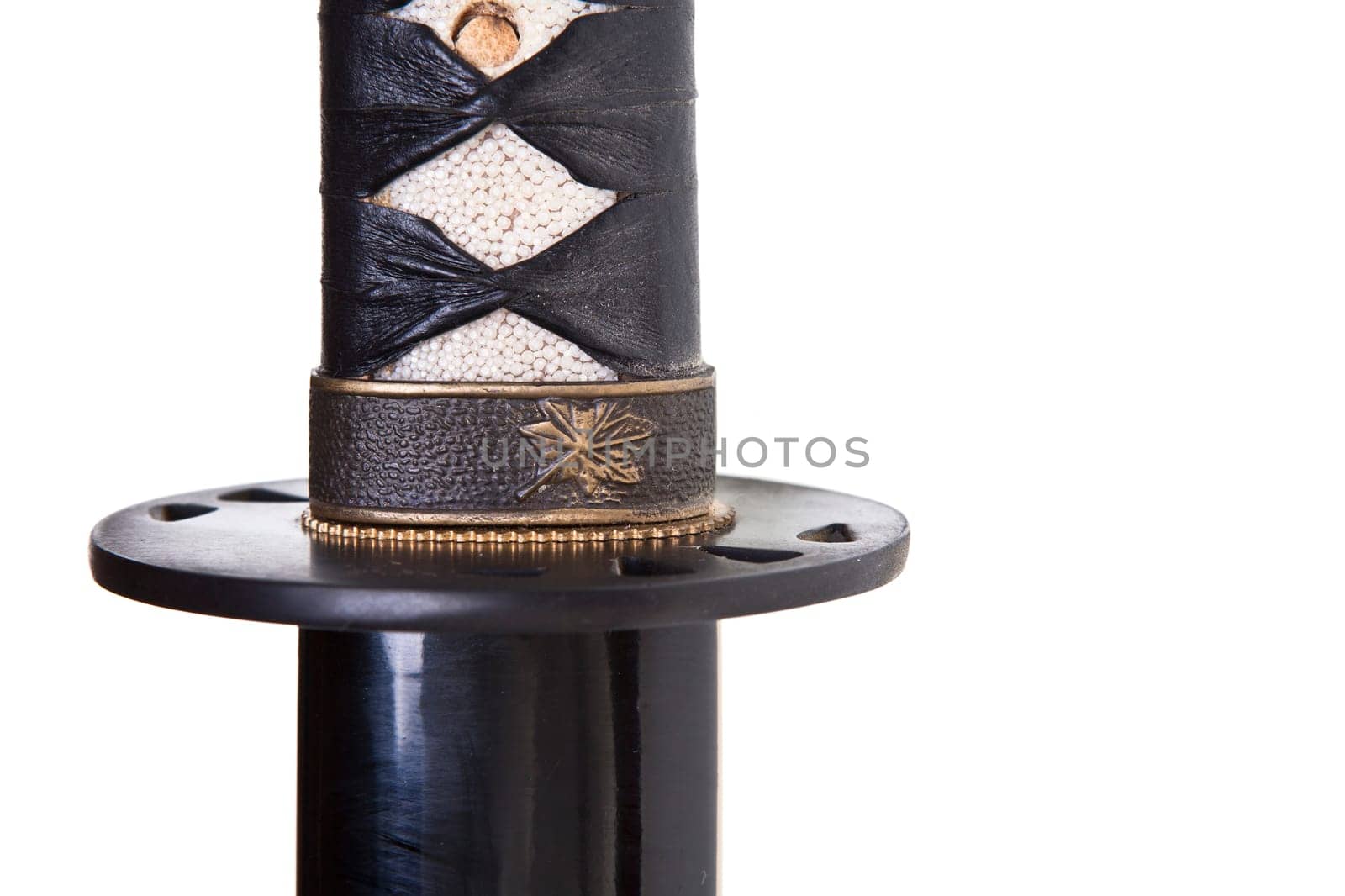 Japanese katana or samurai sword over a white background