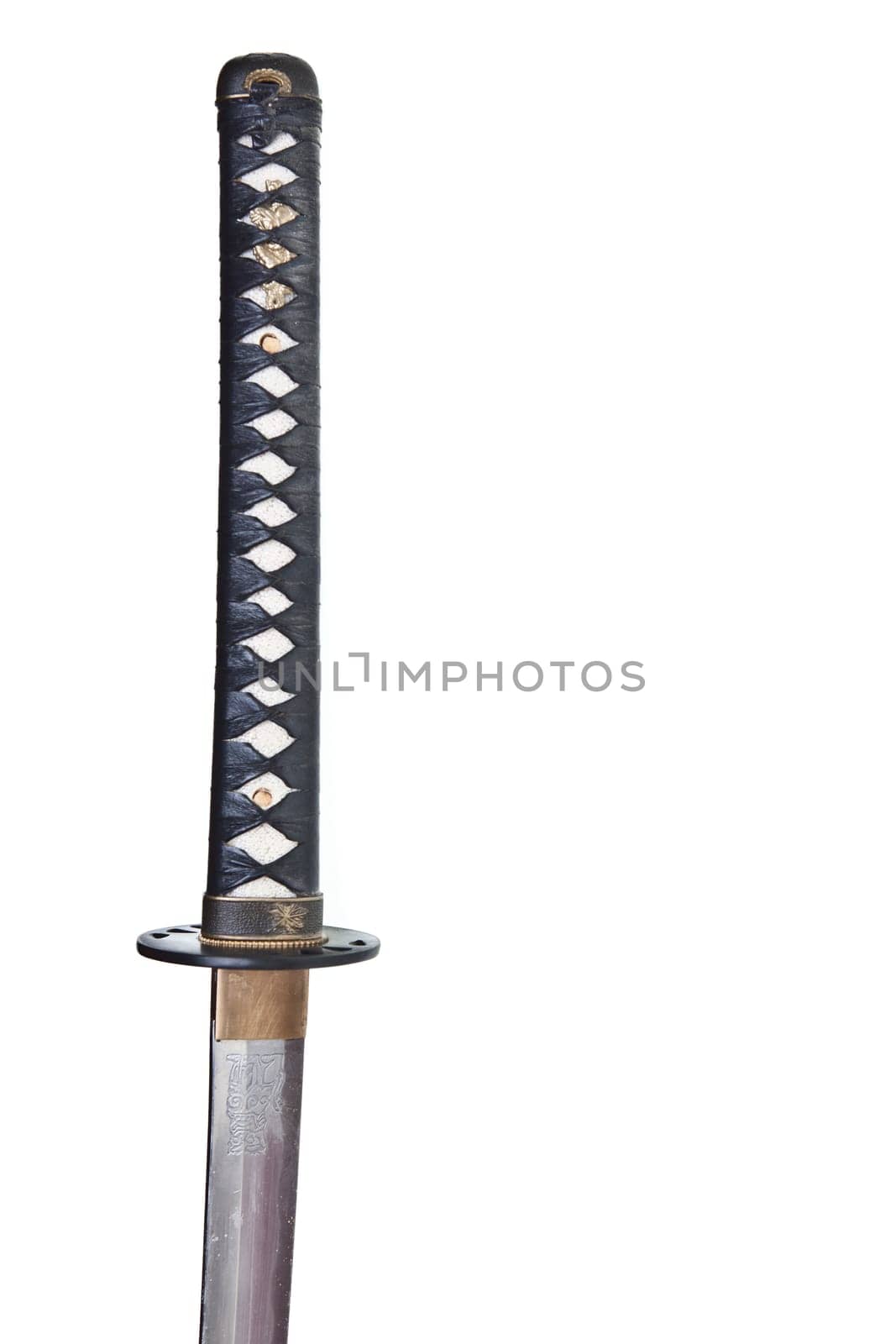 Detail from the very sharp steel blade on a Japanese Samurai sword or Katana.  The blade has to be constantly kept waxed to protect against oxidization and to retain sharpness.