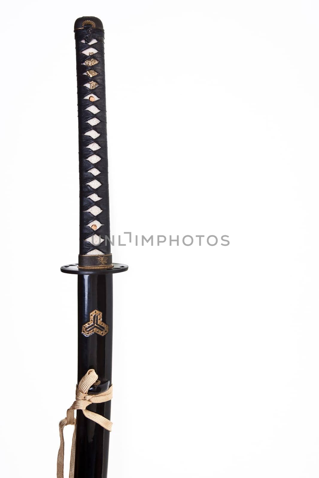Japanese katana or samurai sword over a white background